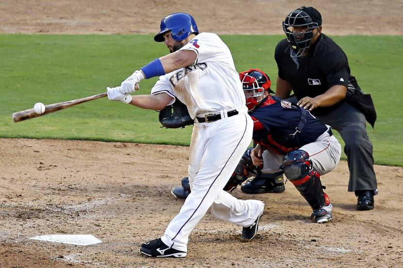 Texas Rangers catcher Bobby Wilson singles to left center and drives in two runs during the...