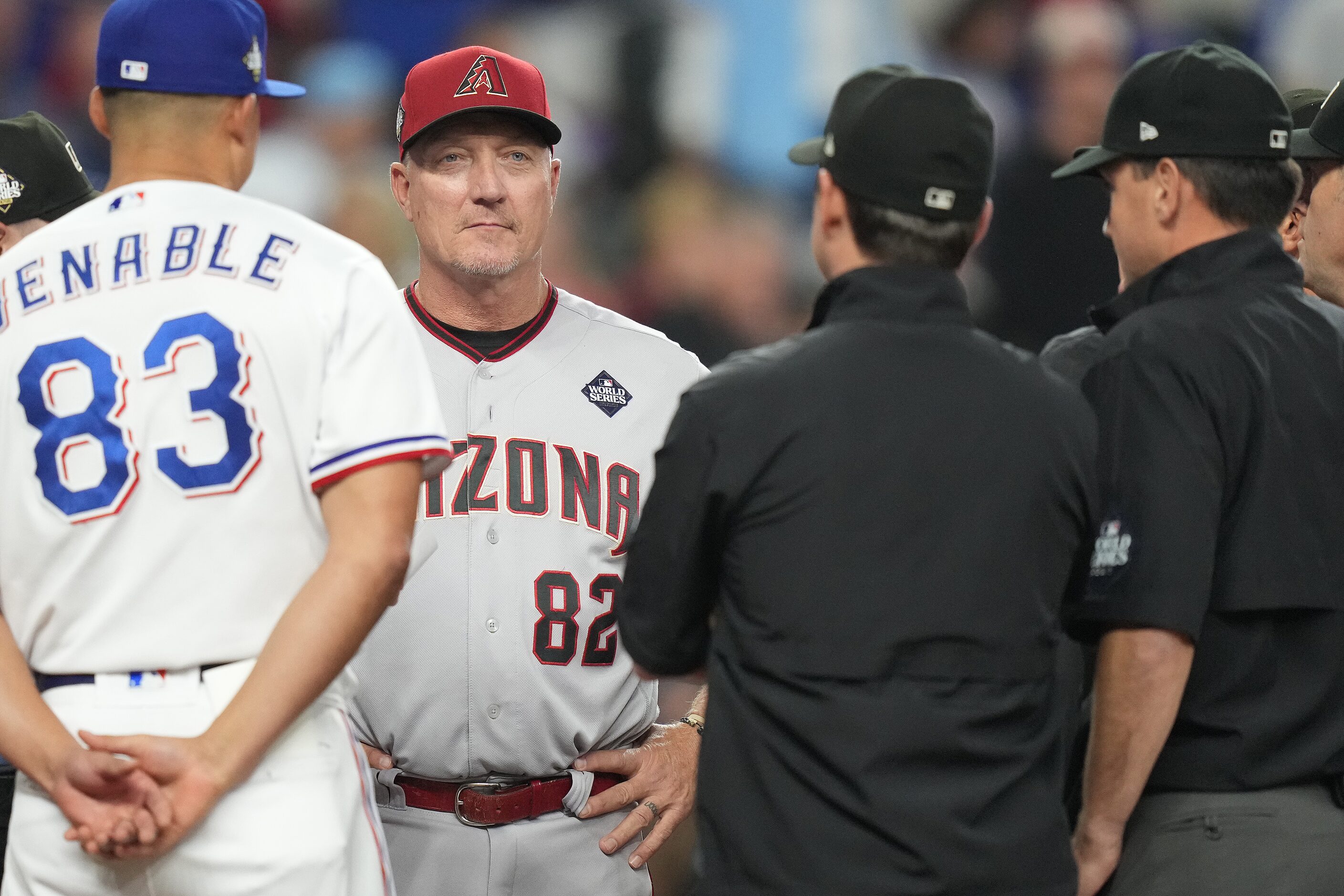 Arizona Diamondbacks bench coach Jeff Banister delivers to the lineup  before Game 2 of the...