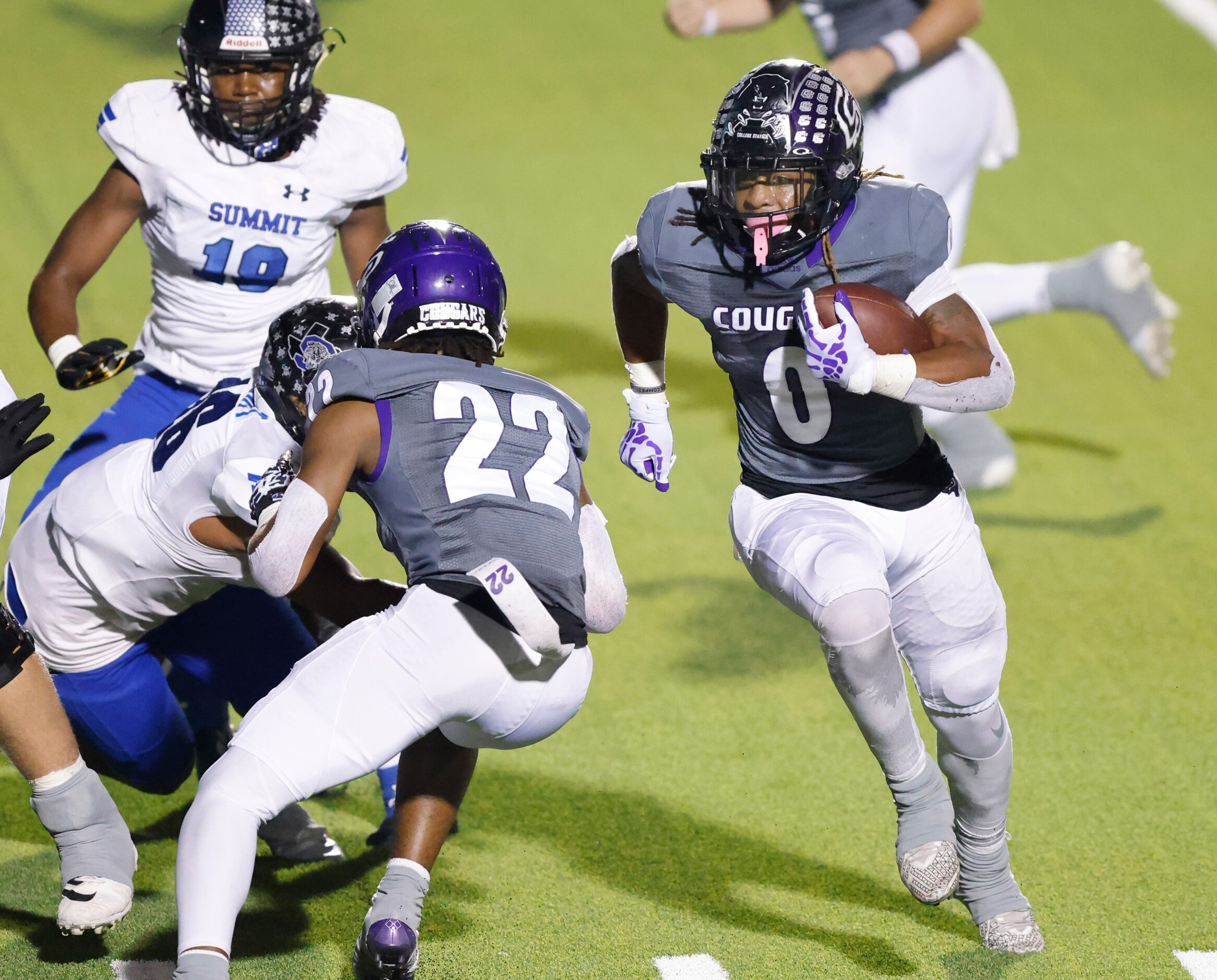 College Station running back Marquise Collins (0) carries the ball around the end for a...