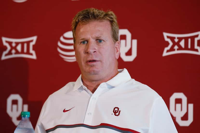 In this Saturday, Aug. 6, 2016 photo, Oklahoma defensive coordinator Mike Stoops talks...