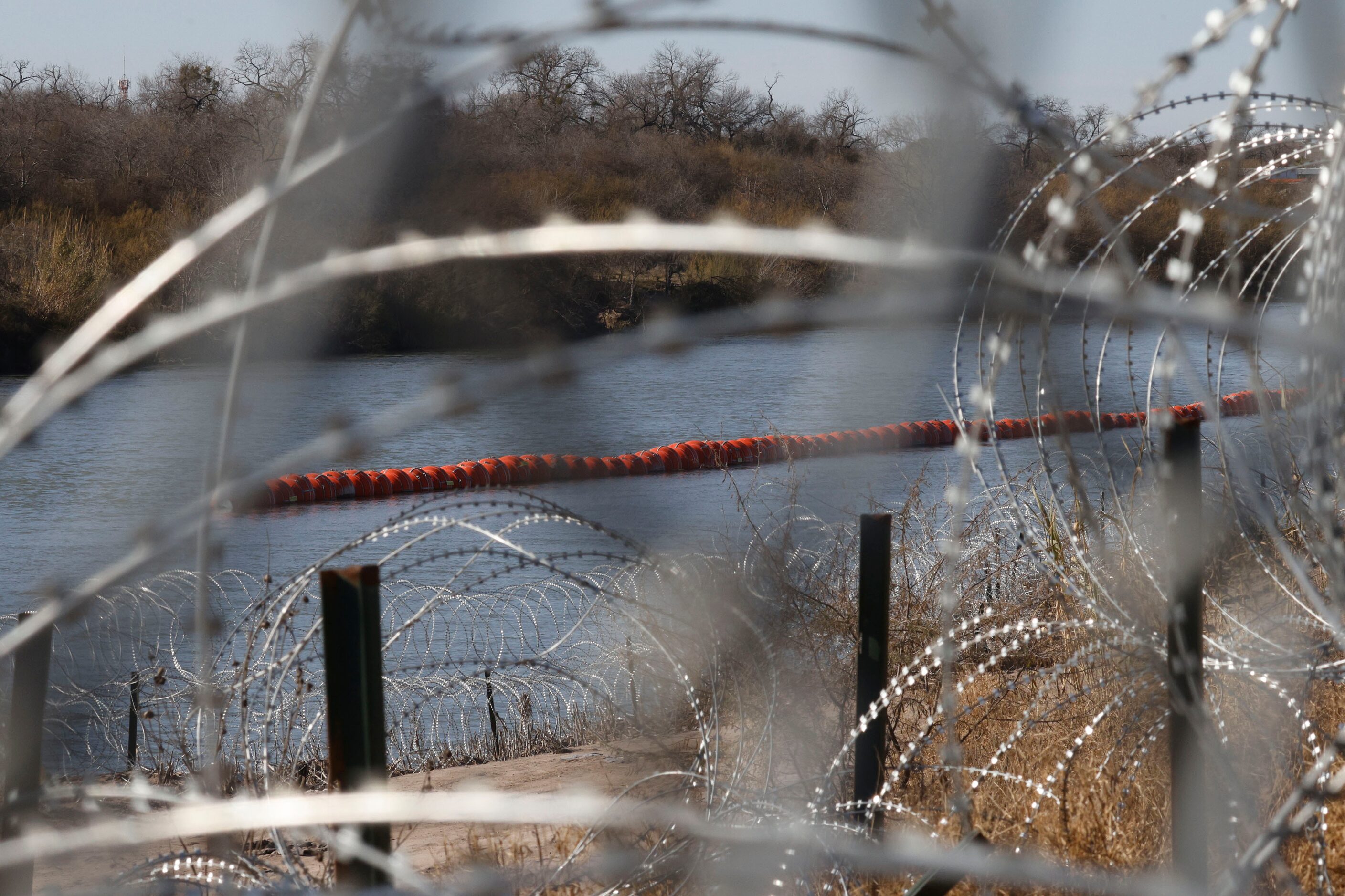  Orange buoys are seen in the Rio Grande,Tuesday, Jan. 30, 2024, in Eagle Pass. 