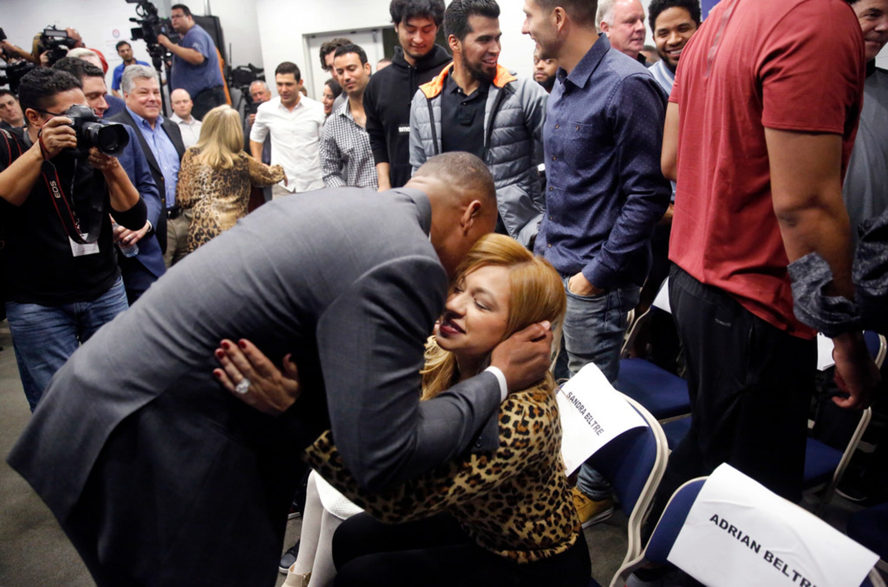 Former Texas Rangers third baseman Adrian Beltre gives his wife Sandra a hug following his...