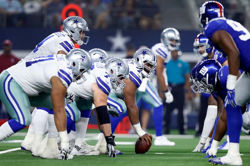 Dallas Cowboys center Joe Looney (73) and the offensive line square off against the New York...