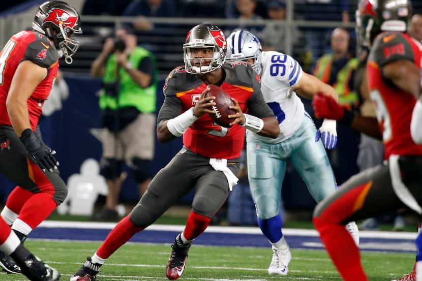 Tampa Bay Buccaneers quarterback Jameis Winston (3) scrambles out of the pocket under...