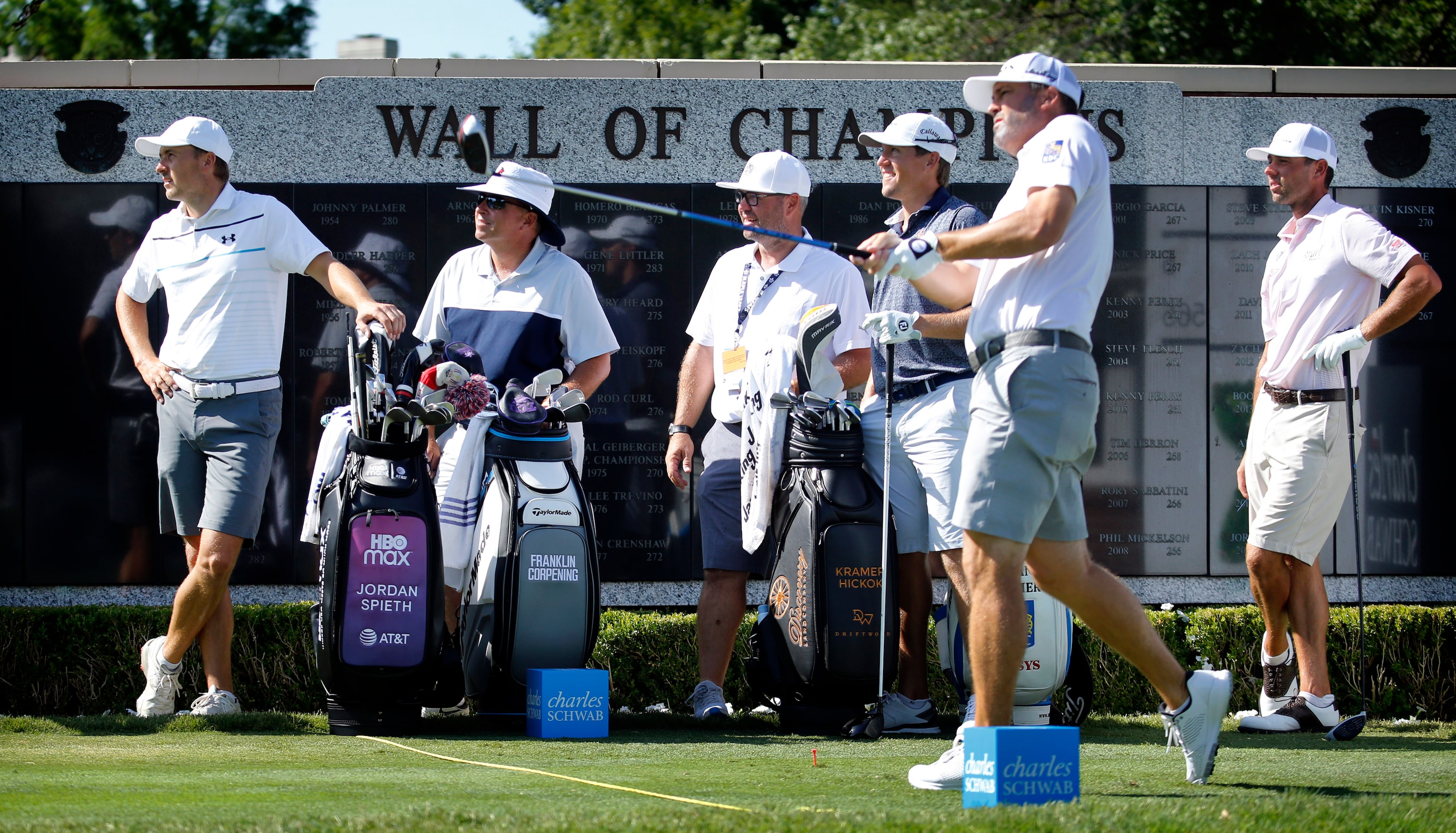 On their first day day back on tour, PGA golfers Jordan Spieth (left) watches Ryan Palmer...