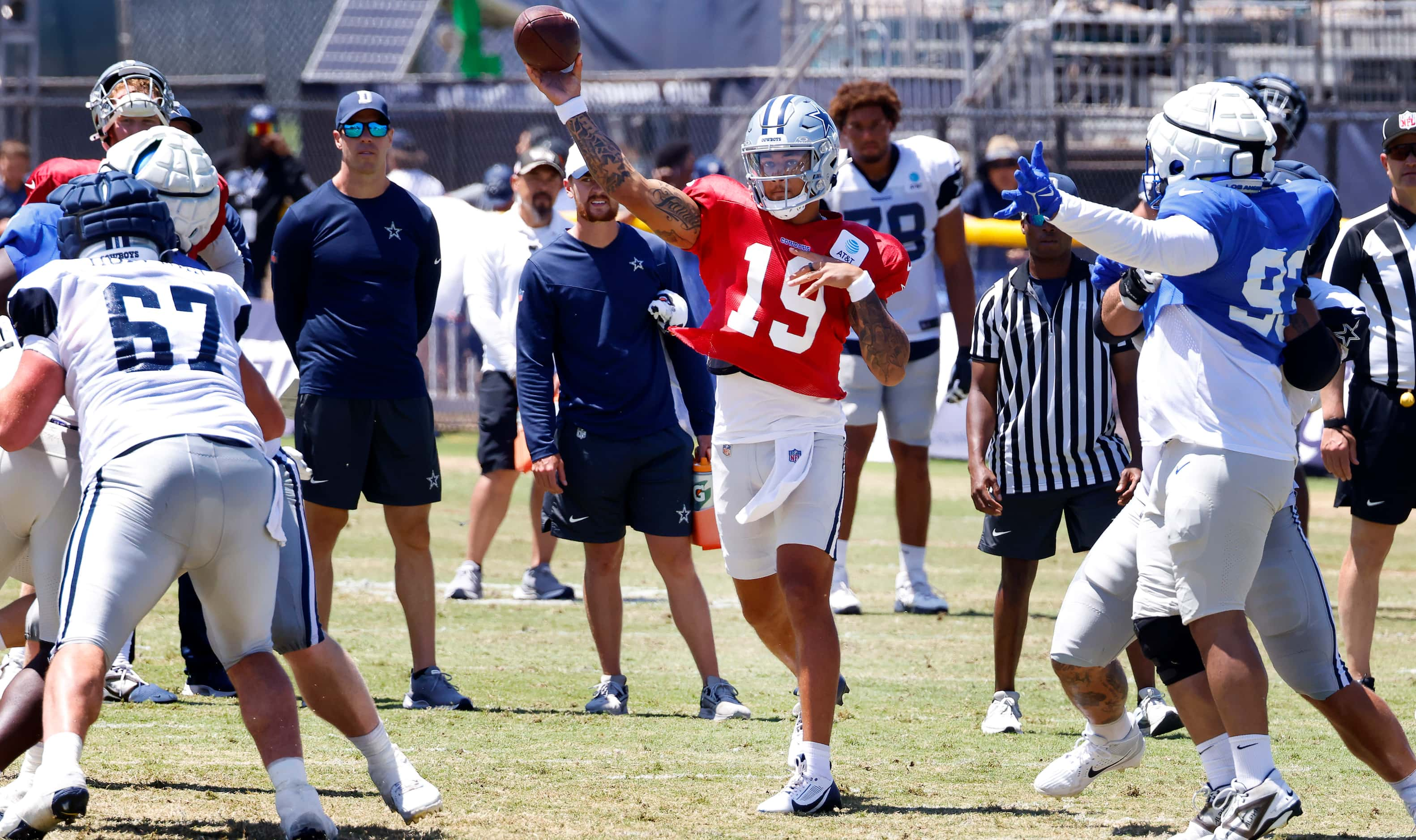 Dallas Cowboys quarterback Trey Lance (19) throws through an opening in the Los Angeles Rams...