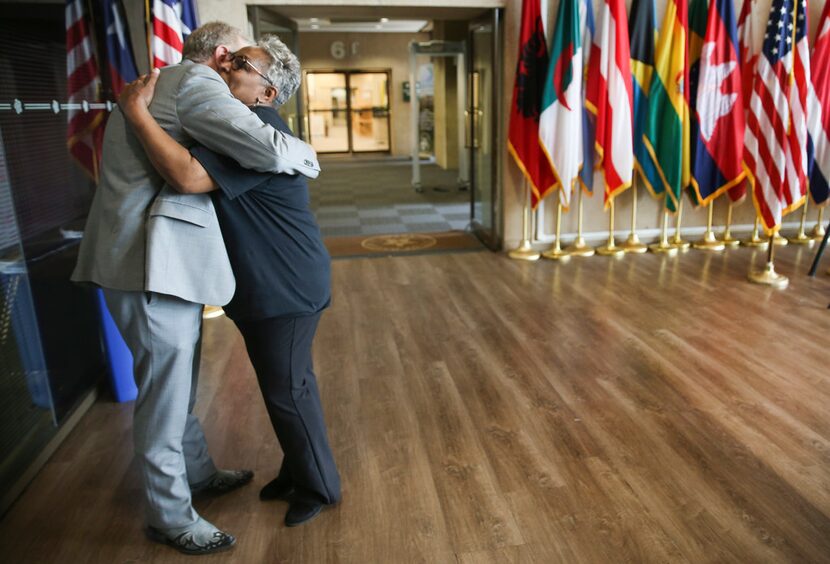 Jim Schermbeck, ead of Downwinders at Risk and Marsha Jackson embraced at a press conference...