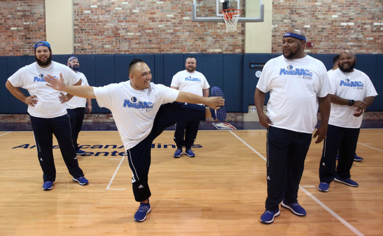 Mavs ManiAAC Eric Coronacion, "Black Rhino" (front left), does a stunt next to Benjamin "Red...