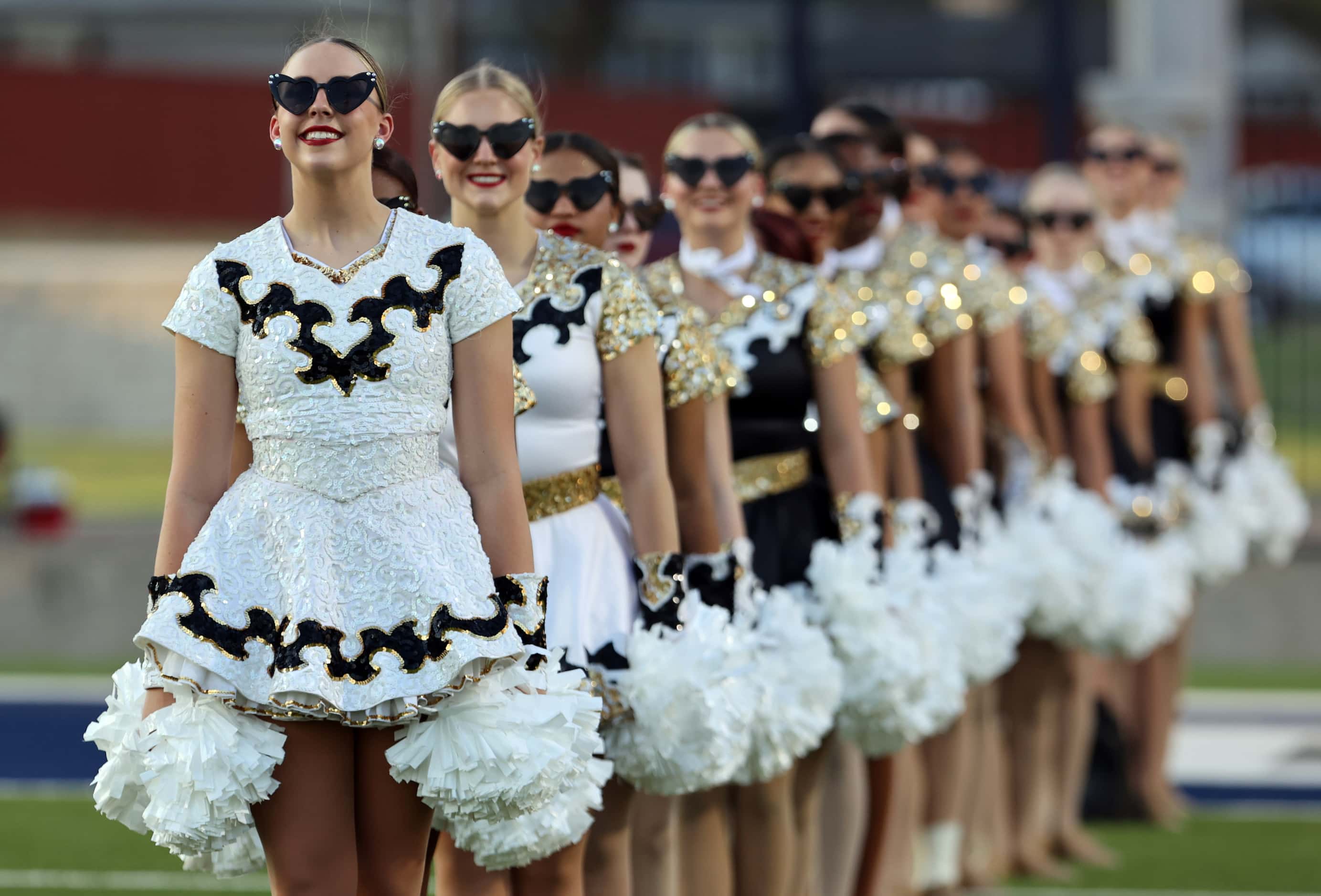 The Forney high drill team sports heart-shaped eyeglasses, while. Waiting for their team to...