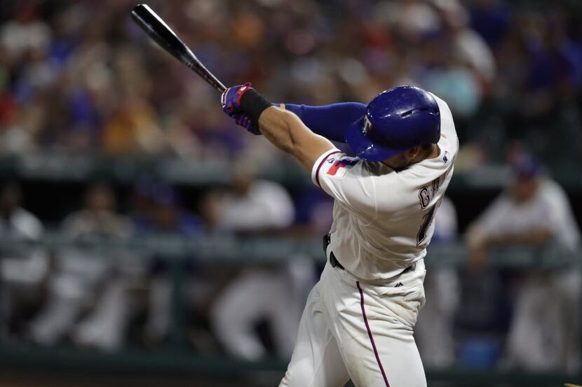 ARLINGTON, TX - JULY 26:  Joey Gallo #13 of the Texas Rangers hits a homerun against the...