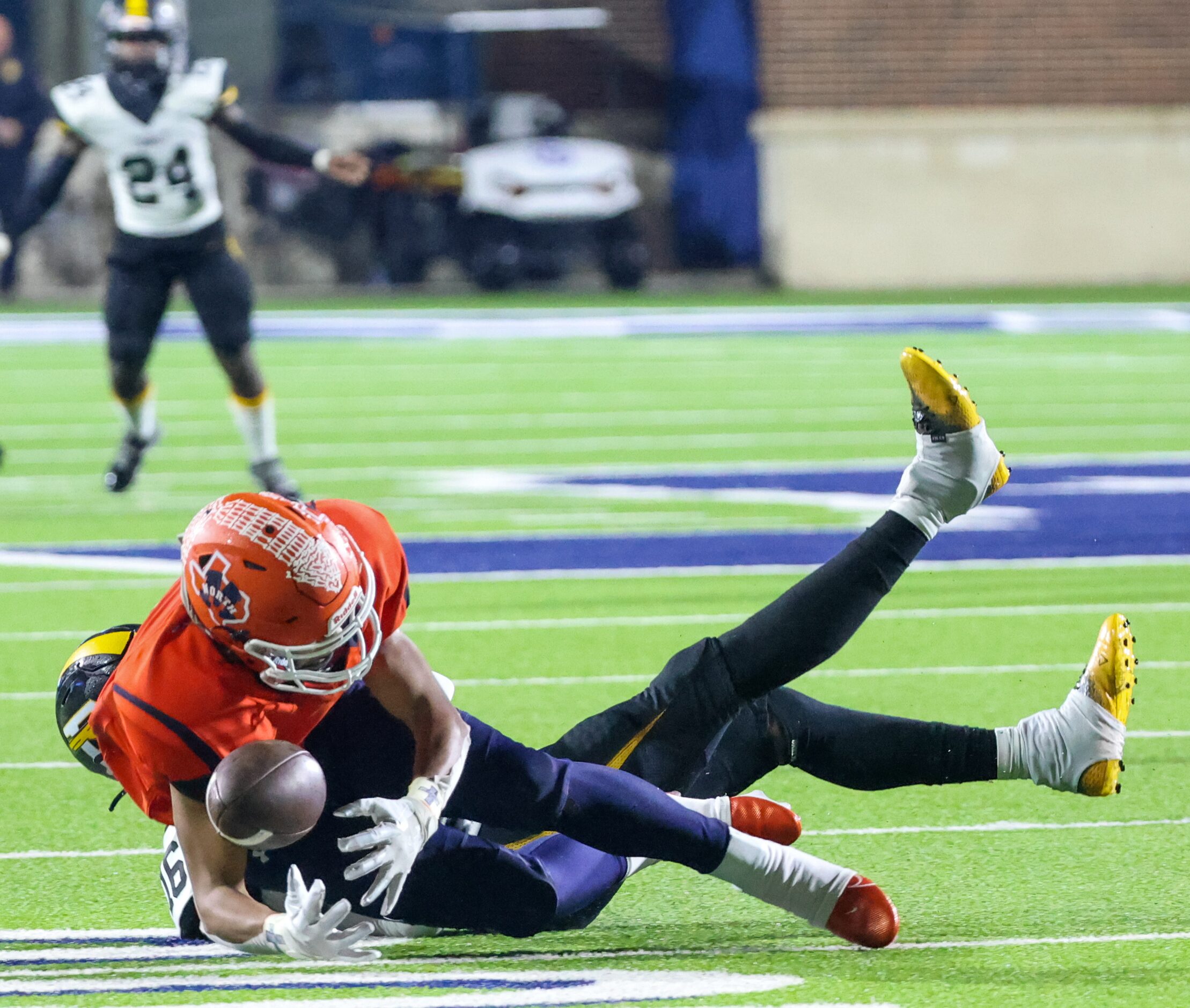 McKinney North quarterback Gavin Constantine (6) loses contact with the ball as he is...