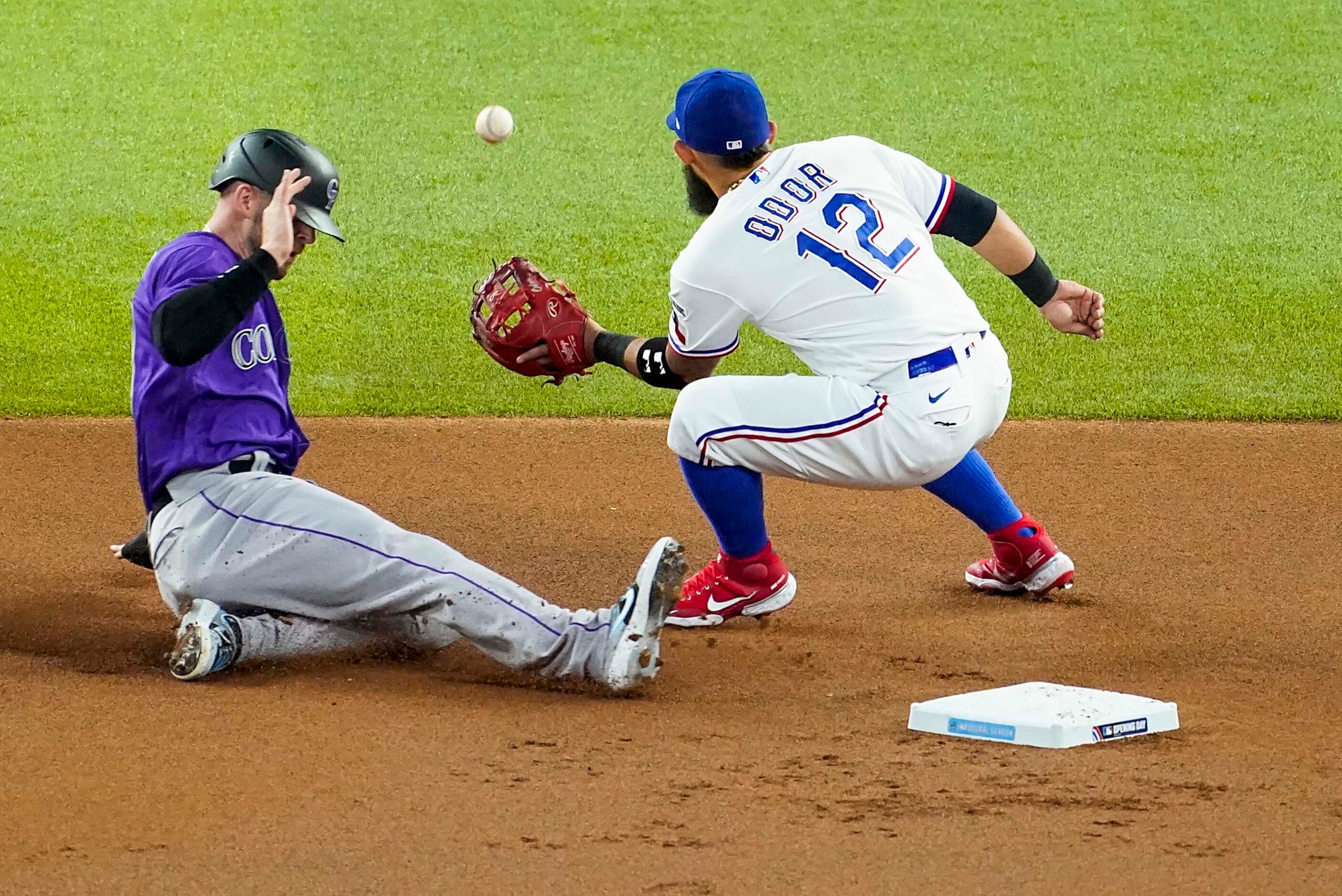 Colorado Rockies shortstop Trevor Story steals second base, the first stolen base in the...