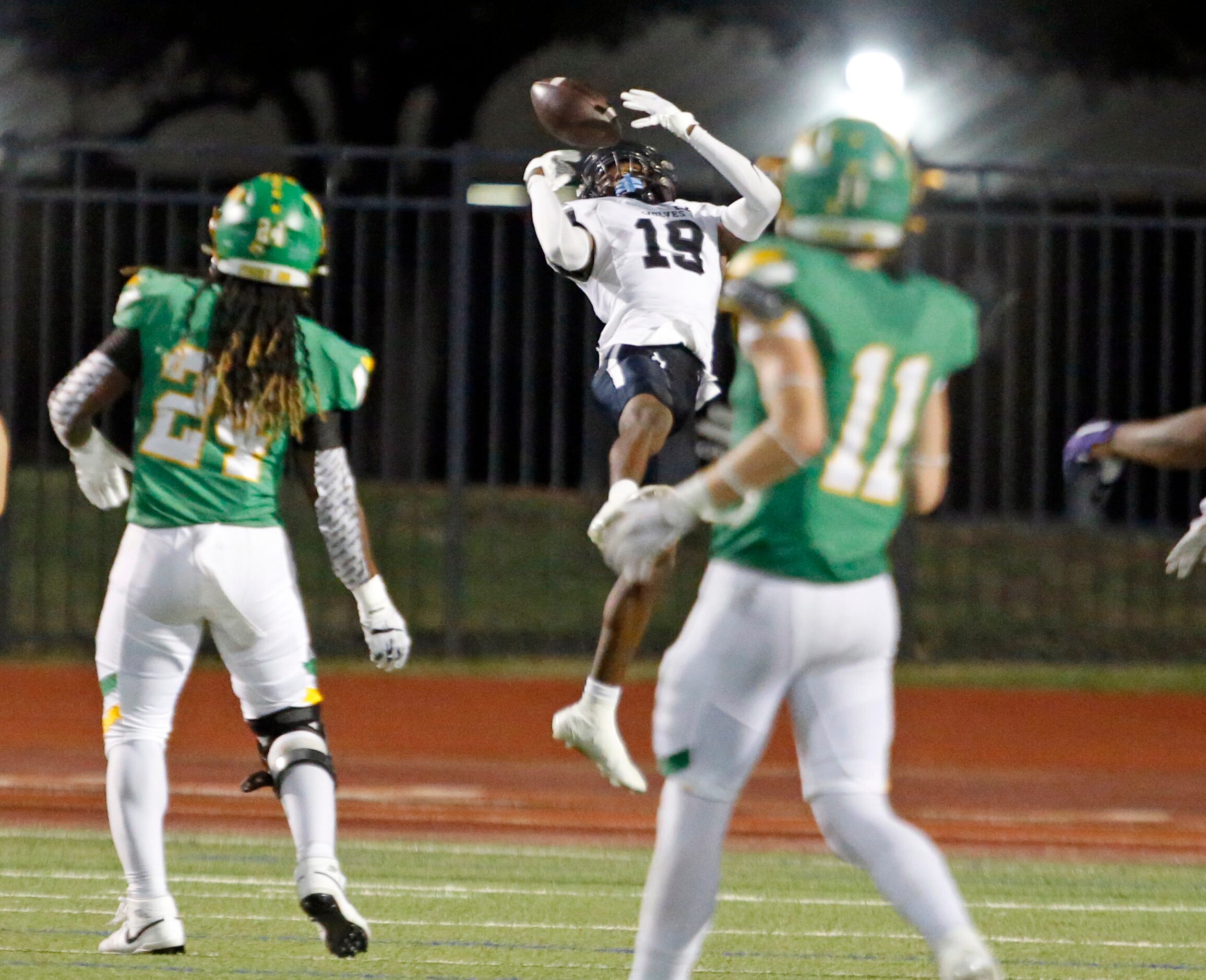 Mansfield Timberview WR Mason Boone (19) gathers in a touchdown pass just before the end of...