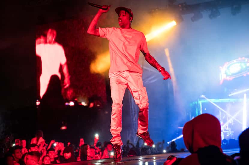 Travis Scott performs on the Wolf Stage. It rained during most of his set at JMBLYA at Fair...