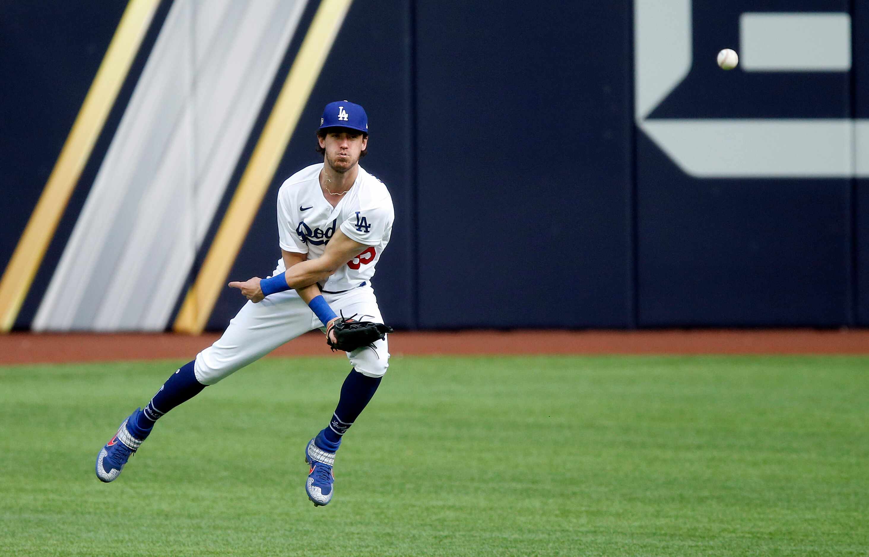 Los Angeles Dodgers center fielder Cody Bellinger (35) snaps throws the ball to second in...