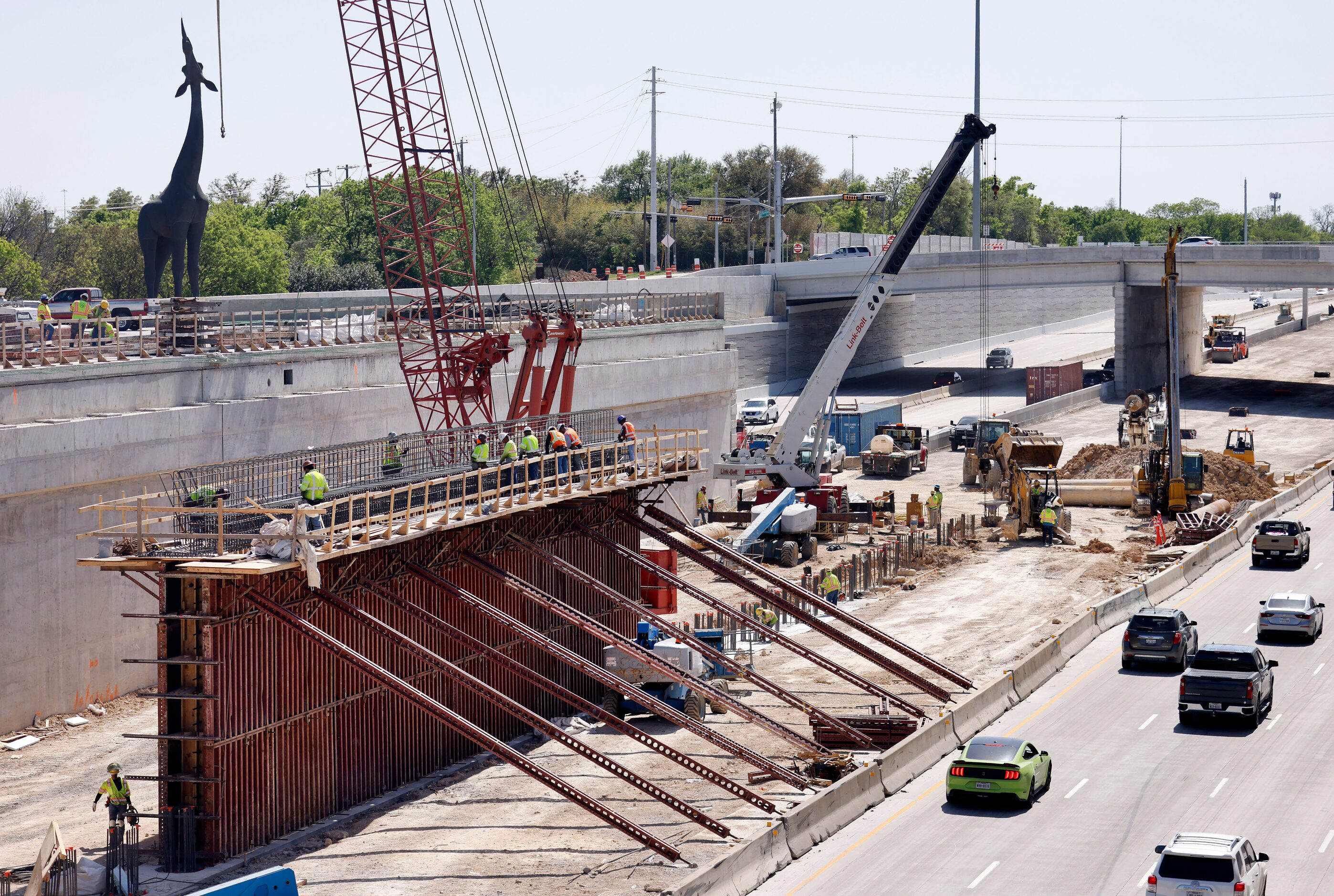 Crews construct a support structure for the $172 million Southern Gateway Park on Interstate...