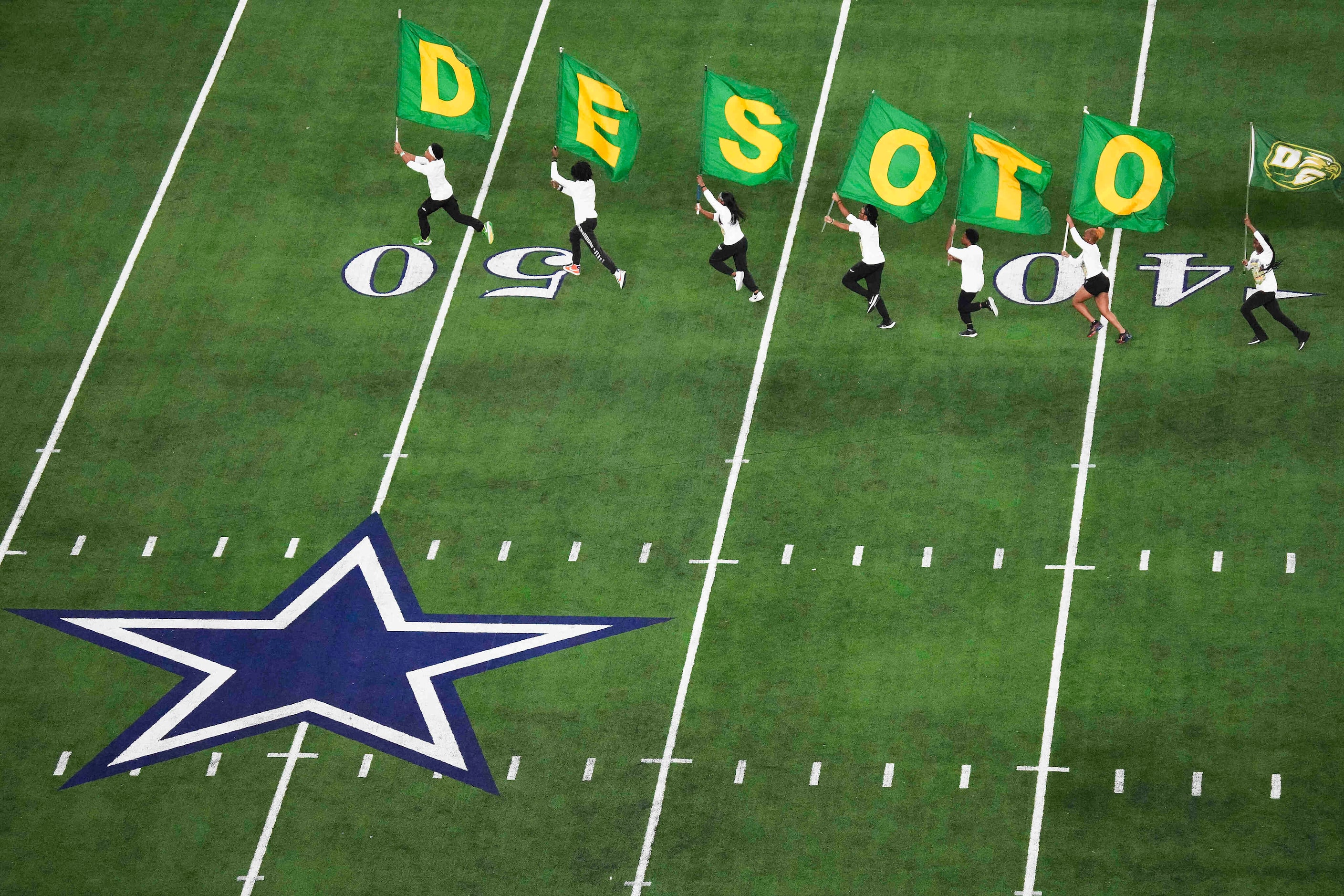 DeSoto flag runners celebrate a touchdown during the second half of the Class 6A Division II...