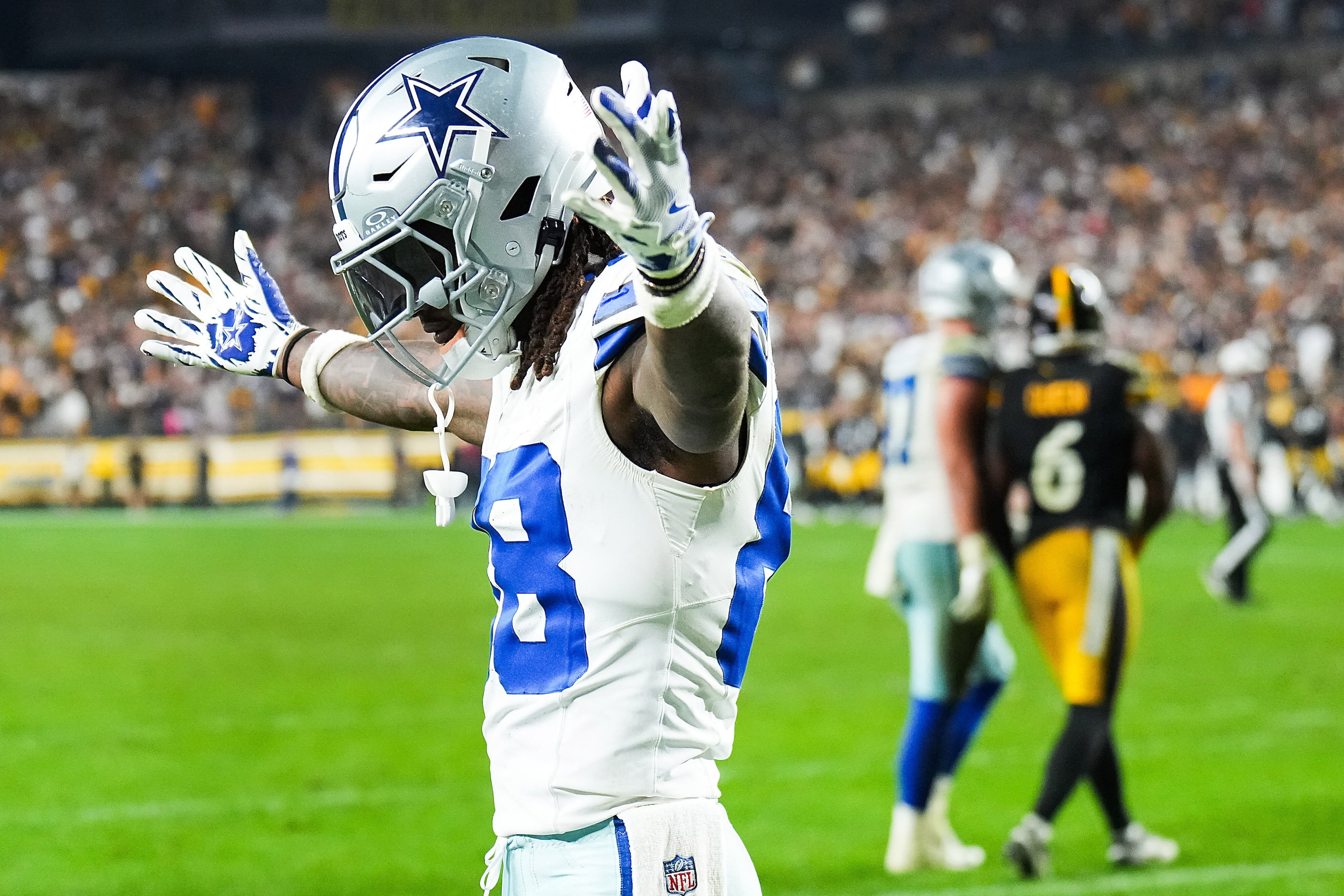 Dallas Cowboys wide receiver CeeDee Lamb (88) celebrates after Jalen Tolbert (1) scored on a...