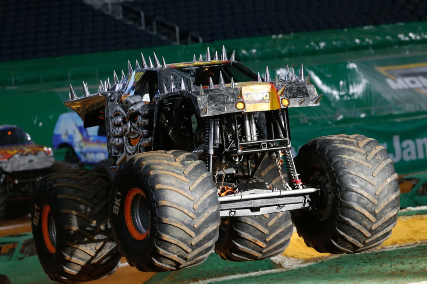 Max-D driven by Tom Meents jumps a ramp during a practice for Monster Jam at AT&T Stadium in...
