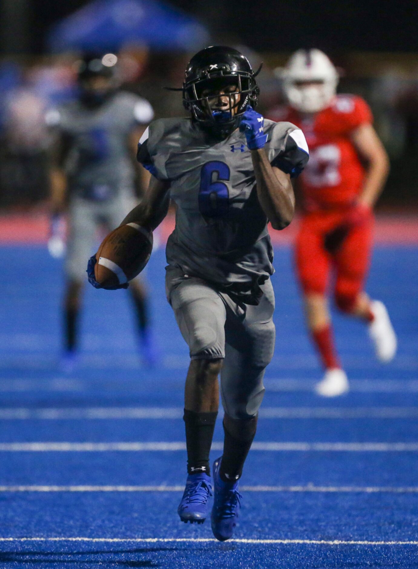 Trinity Christian-Cedar Hill's Cameron Wilson (6) makes a run during a high school football...