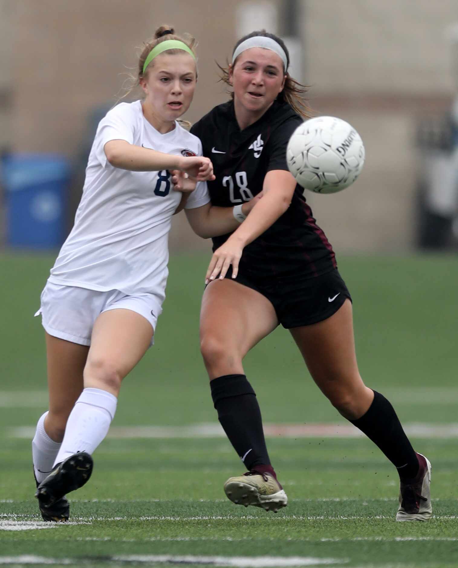 Wakeland's Brooke Hartshorn (8) and Dripping Springs' Taylor Hodsden (28) chase after the...