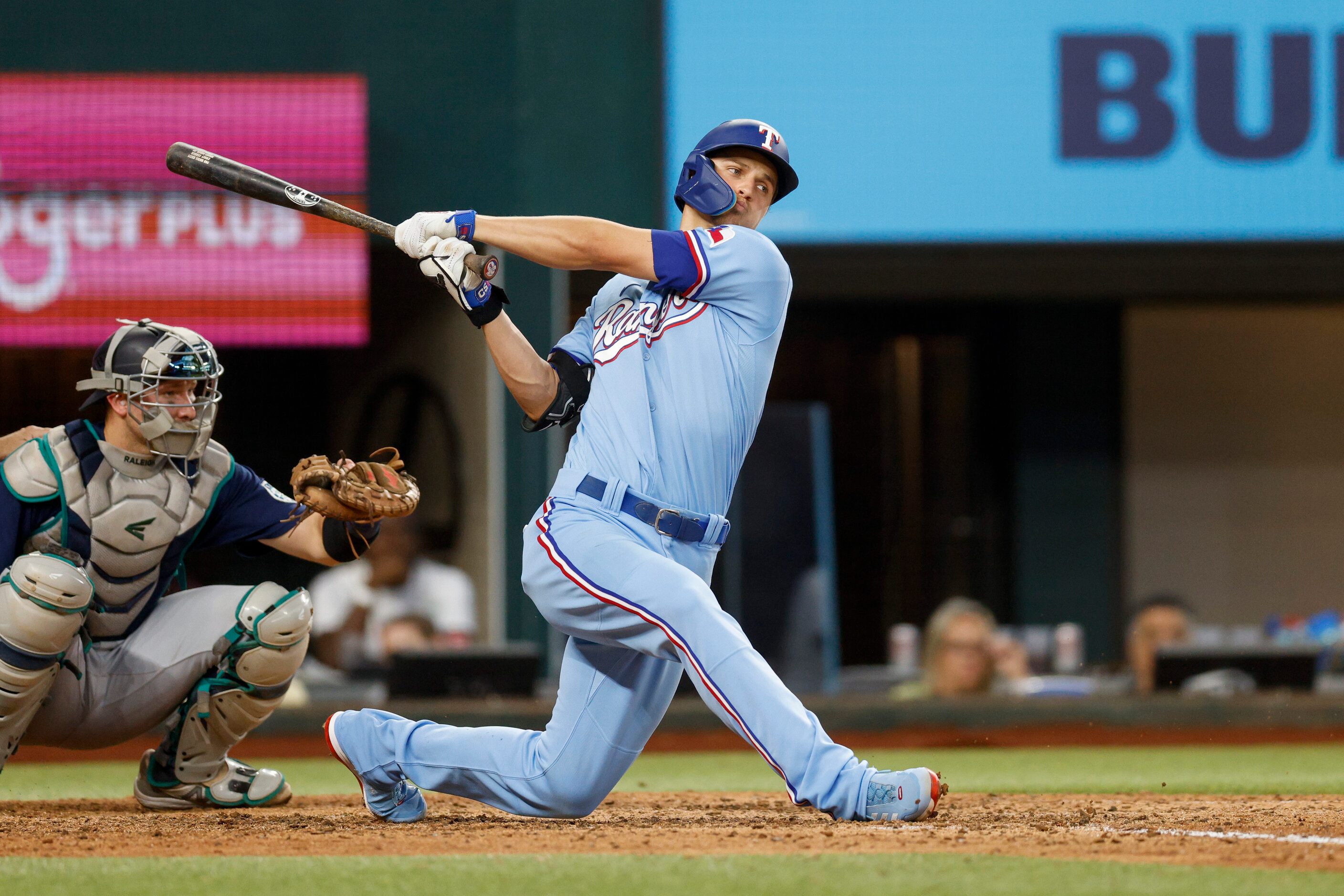 Texas Rangers shortstop Corey Seater (5) drops to his knee as he strikes out during the...