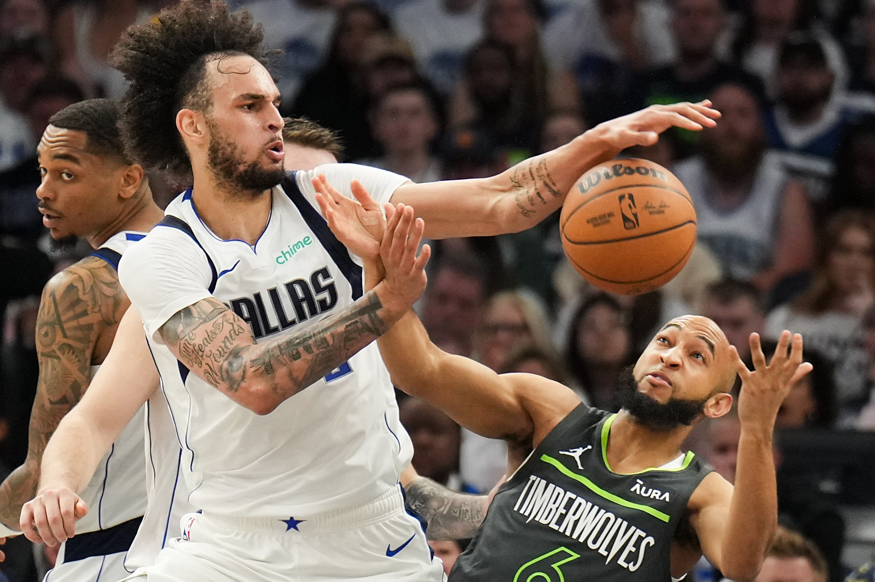 Dallas Mavericks center Dereck Lively II (2) knocks the ball away from Minnesota...