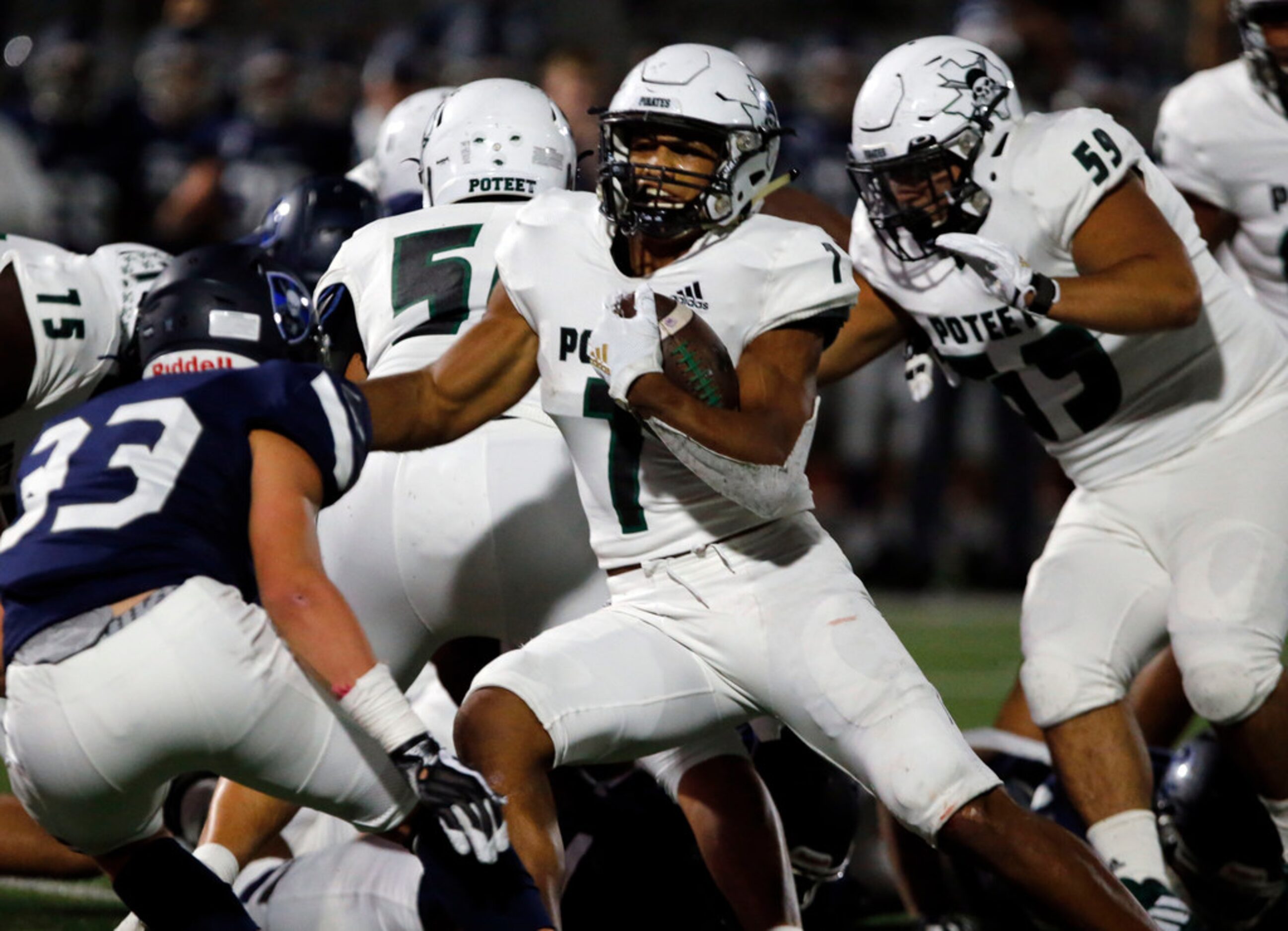 Mesquite Poteet's Seth McGowan (7) picks up a first down during the first half of their high...