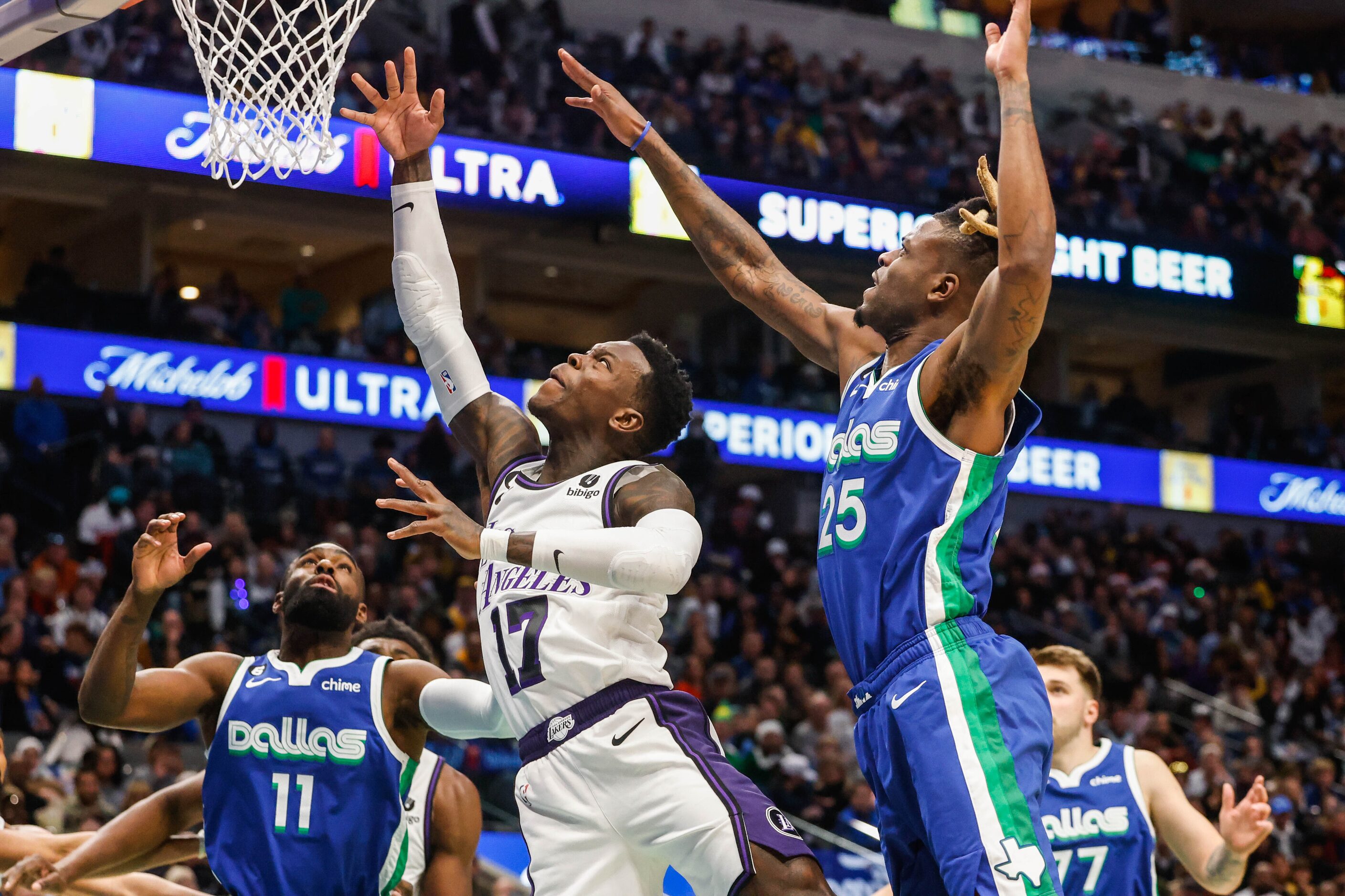 Los Angeles Lakers guard Dennis Schroder (17) goes for a shot as Dallas Mavericks forward...