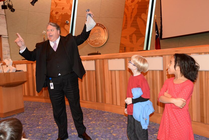 Hogue  performs  his disappearing spot trick to teach Birmingham Elementary first-graders...