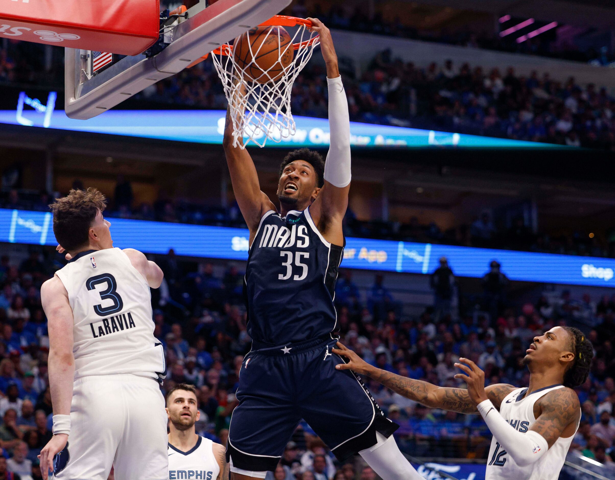 Dallas Mavericks center Christian Wood (35) dunks the ball as Memphis Grizzlies forward Jake...