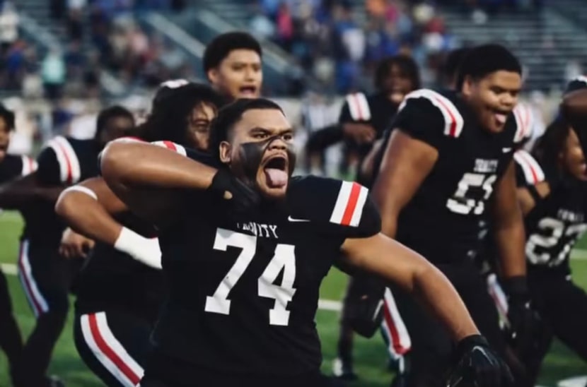 Tuipulotu (74) performs the Sipi Tau with his teammates before a game, which the program has...