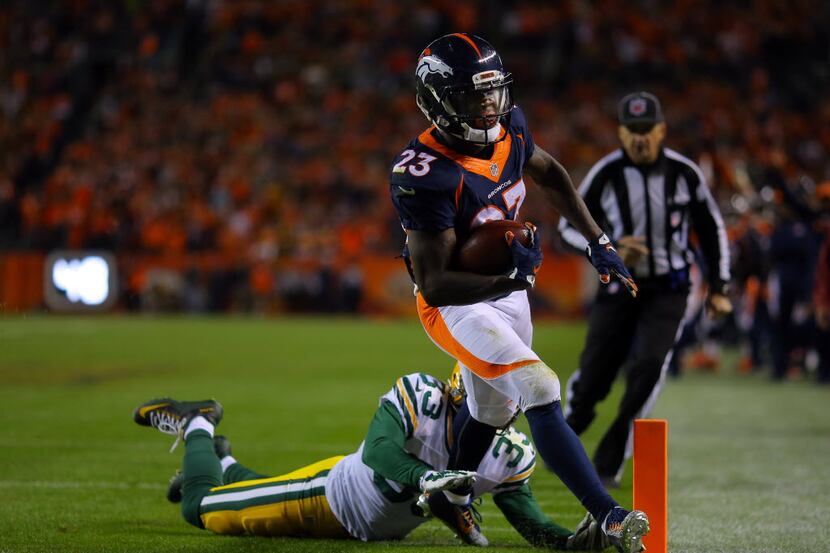 DENVER, CO - NOVEMBER 01:  Ronnie Hillman #23 of the Denver Broncos runs in a touchdown...