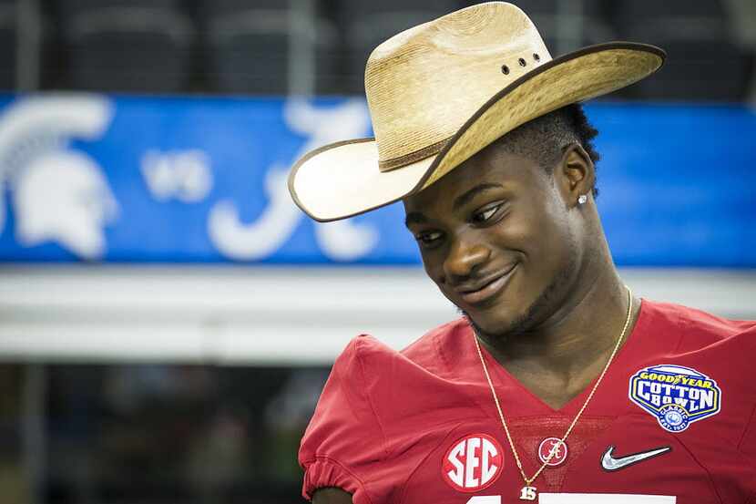 Alabama defensive back Ronnie Harrison wears a cowboy hat for an interview during Cotton...