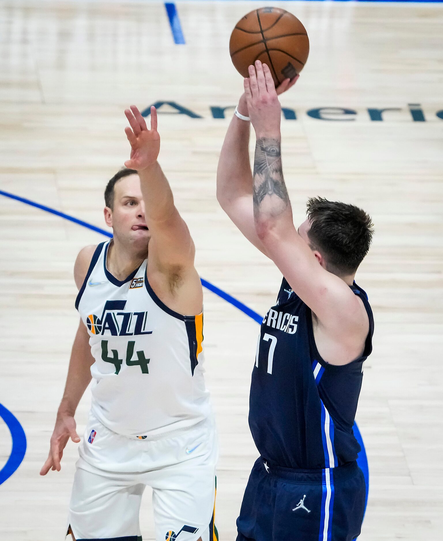 Dallas Mavericks guard Luka Doncic (77) shoots a 3-pointer over Utah Jazz forward Bojan...