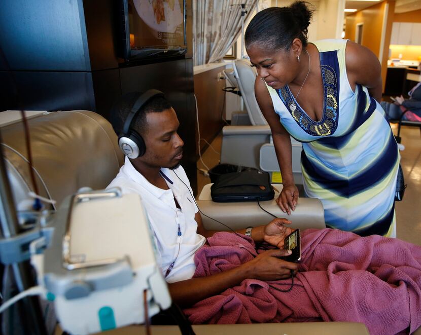 Sherita Lindsey has a moment with her son Robert Sasser while he receives chemotherapy...