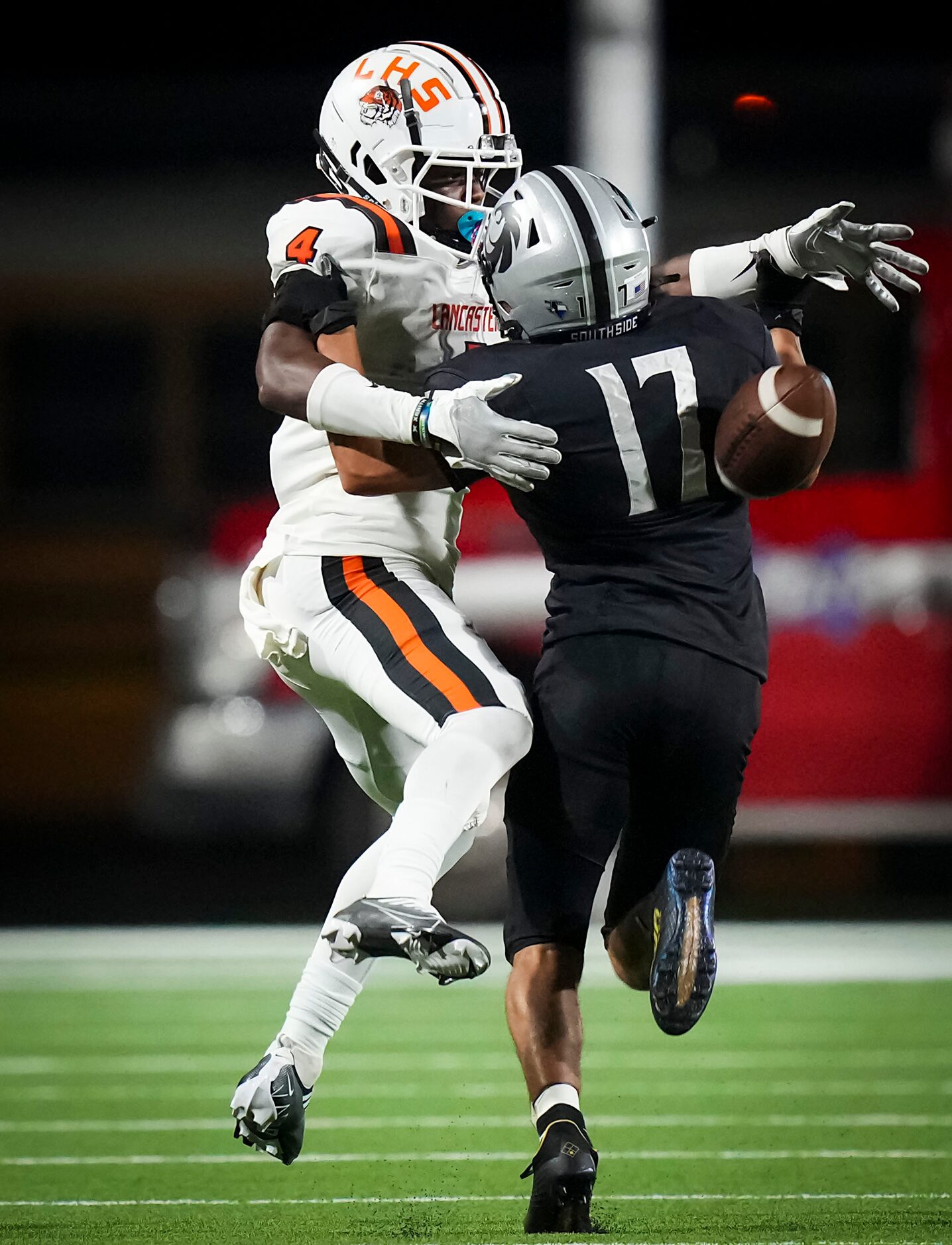 Denton Guyer defensive back Elijah Taylor (17) breaks up a pass intended for Lancaster wide...