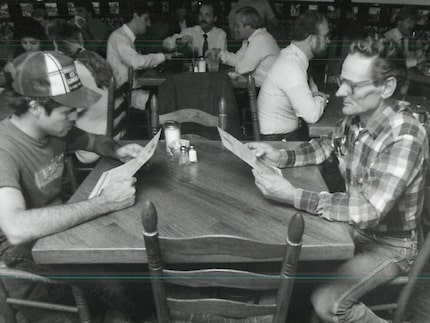 In this Dallas Morning News file photo from 1988, Frank Owen (left) and Pierre Littiere eat...