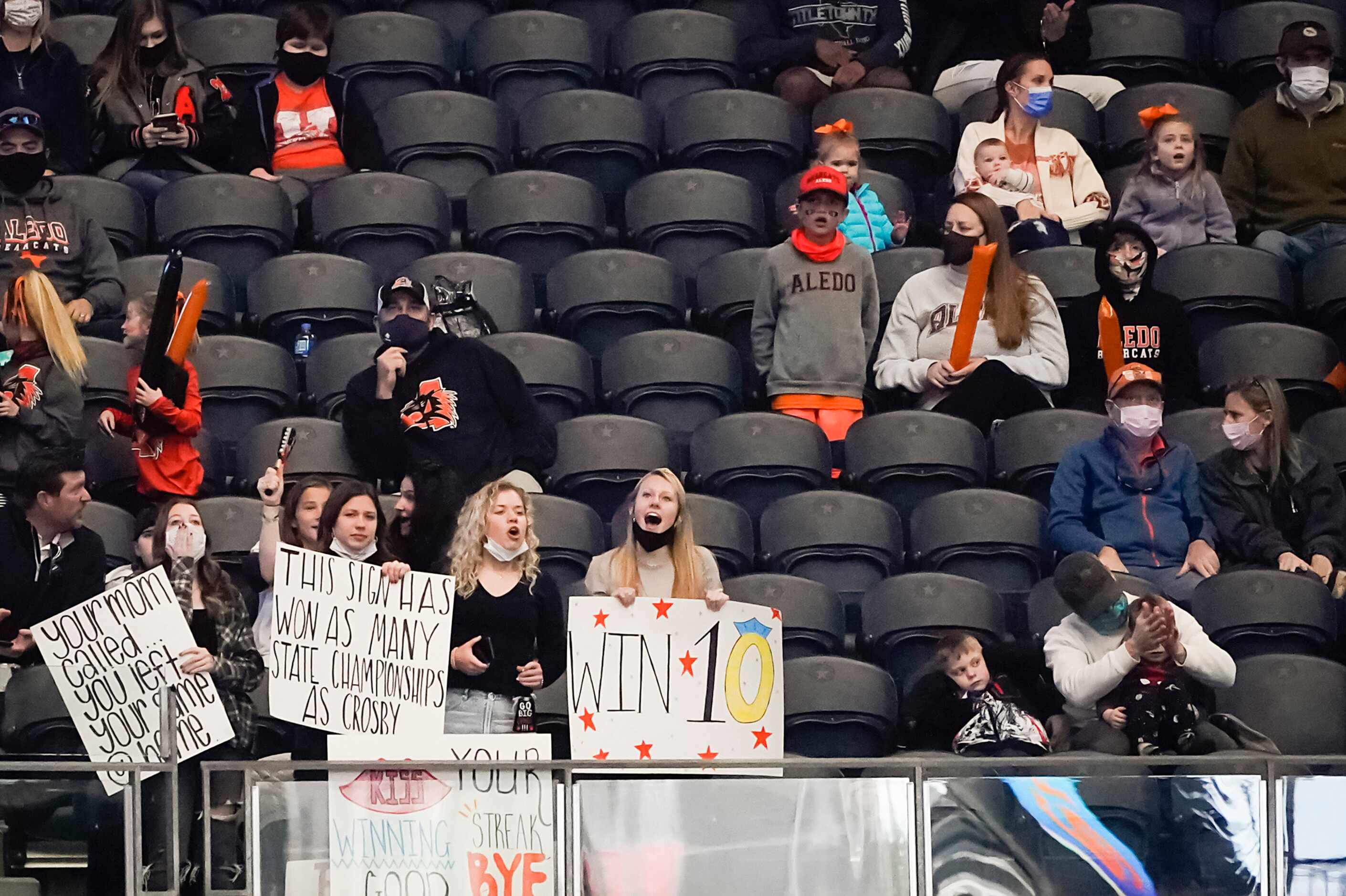 Aledo fans cheer their team, hoping for a 10th state title, during the first half of the...