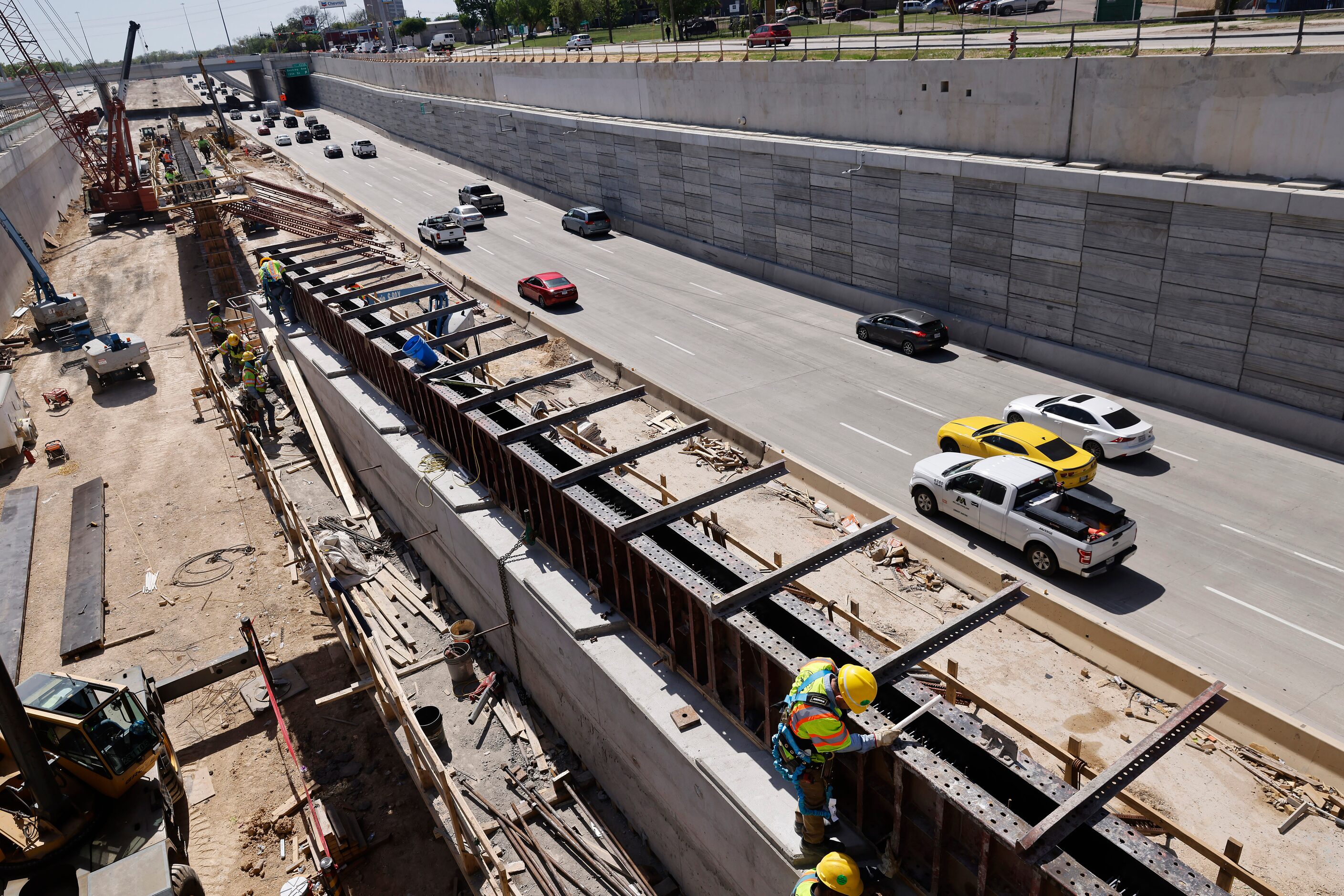 Crews construct support structures for the $172 million Southern Gateway Park on Interstate...