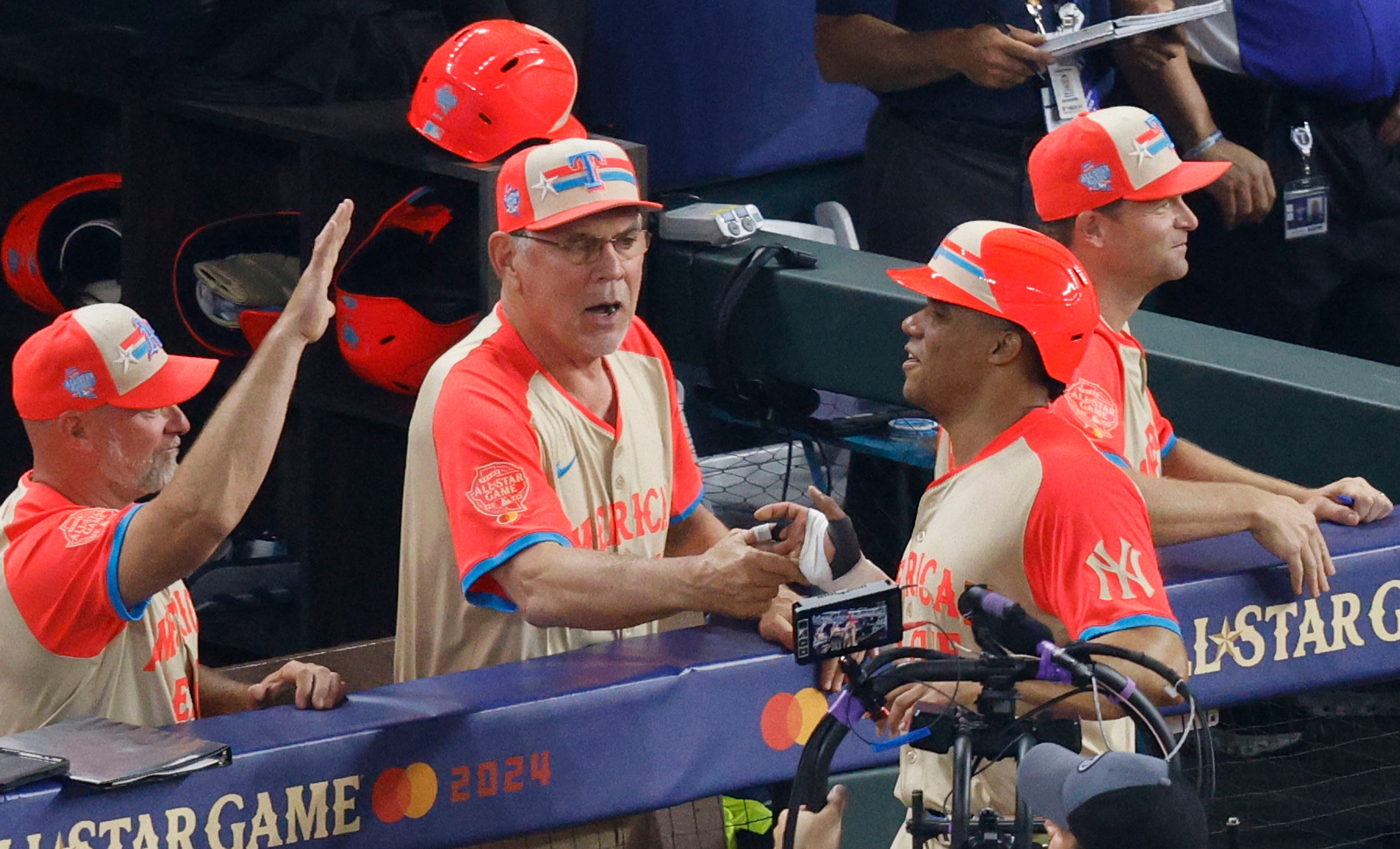 American League outfielder Juan Soto of New York Yankees (22), right, is congratulated by...