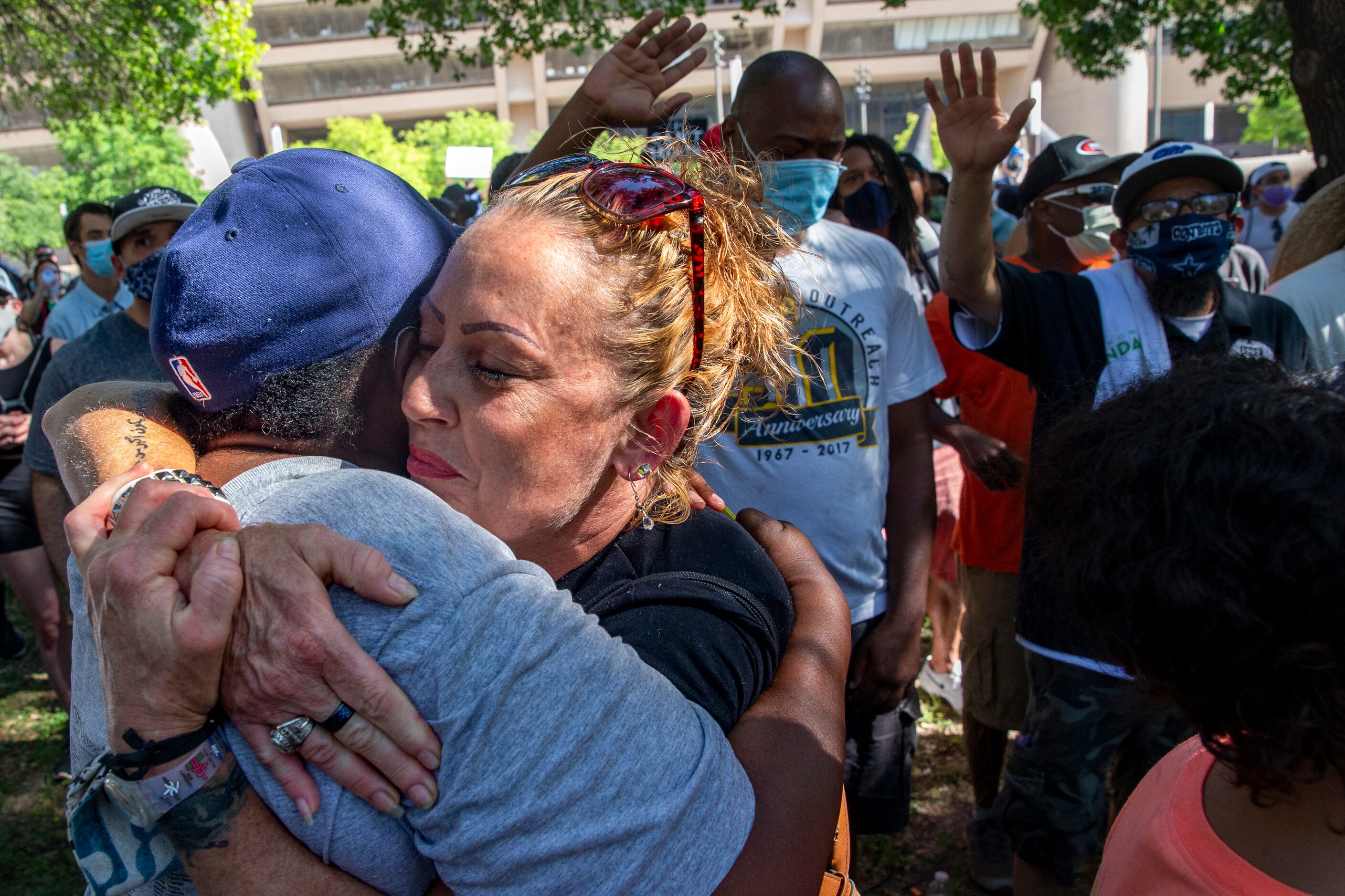 From left, Sharon Offord and Danielle Romero embrace during worship at the Community of...