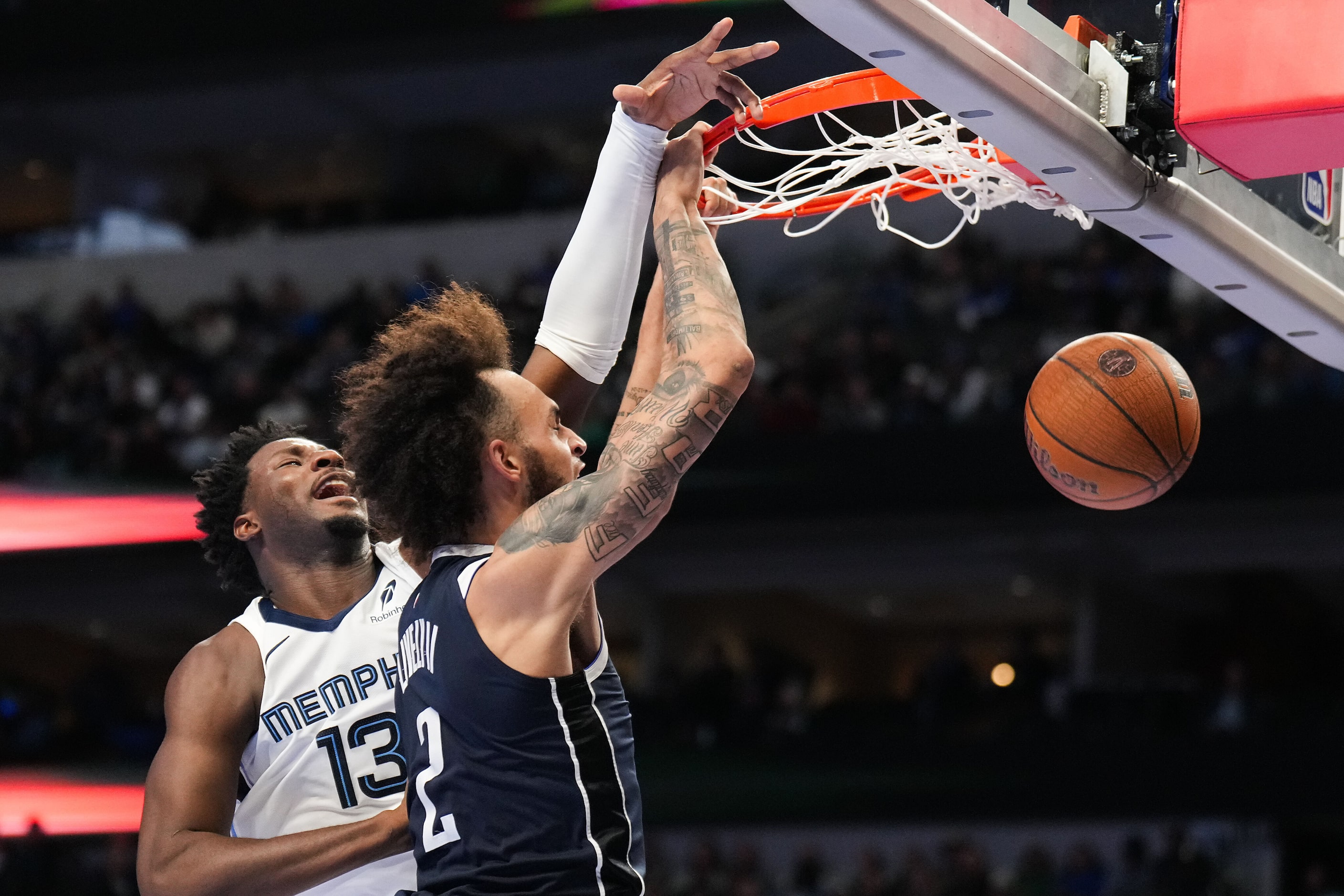 Dallas Mavericks center Dereck Lively II (2) dunks past Memphis Grizzlies forward Jaren...