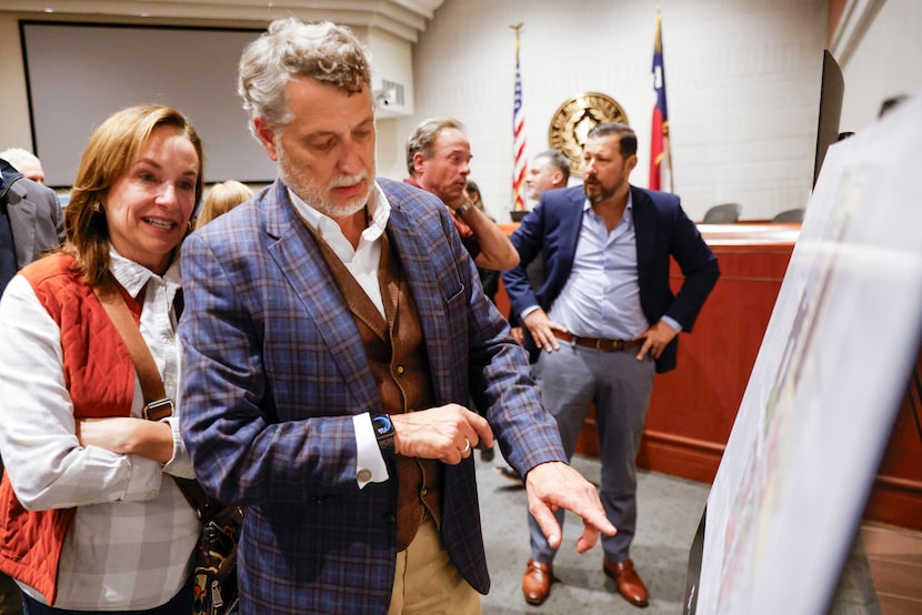 McKinney resident Cala Pence (left) and Rick Wells, owner of Harvest at the Masonic, study...