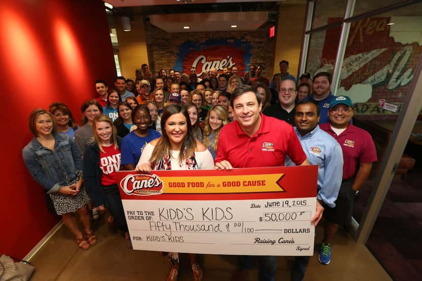 Raising Cane's founder and CEO Todd Graves presented the check to Caroline Cradick,...