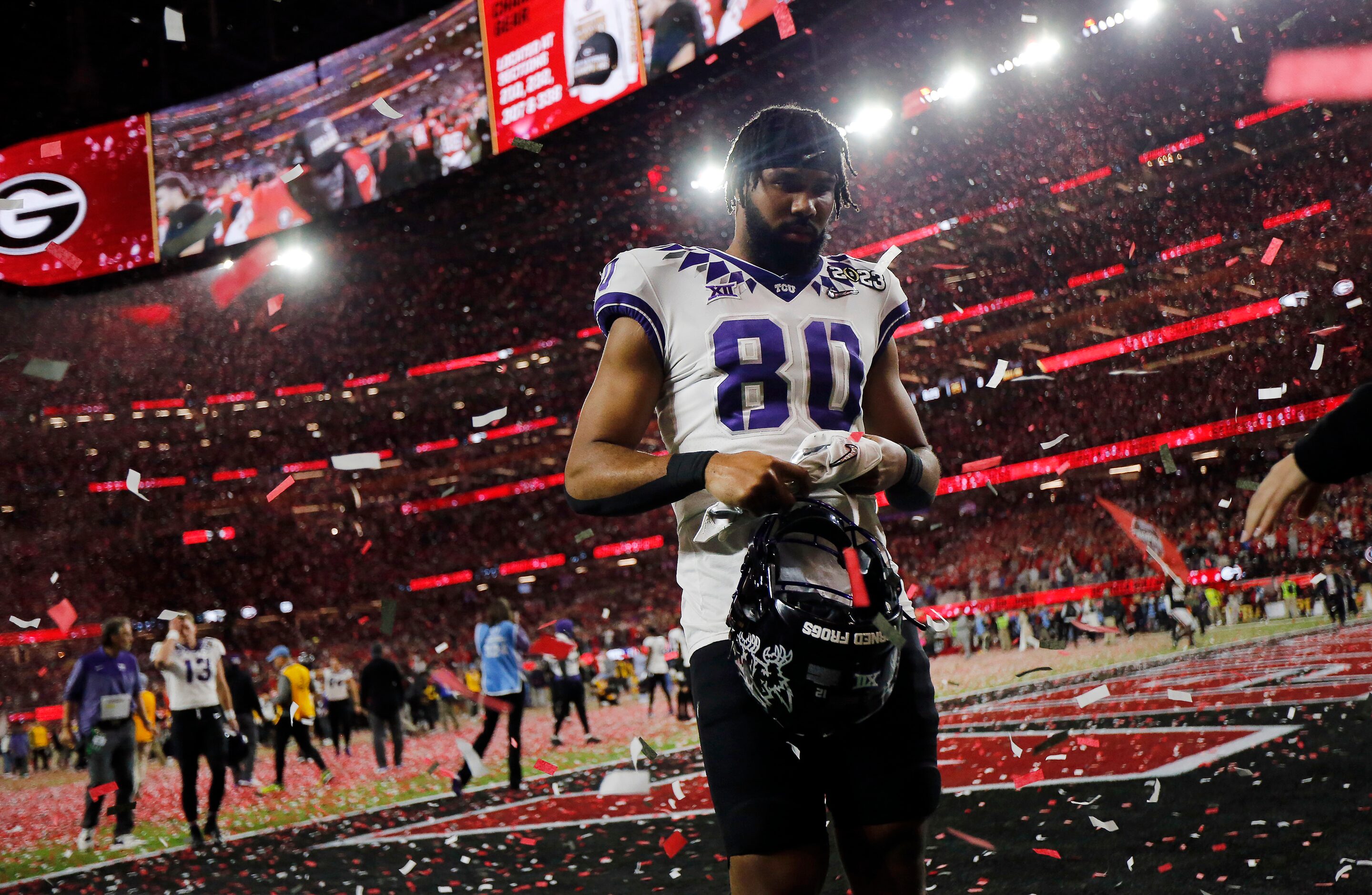 As Georgia Bulldogs red confetti rains down, TCU Horned Frogs tight end D'Andre Rogers (80)...