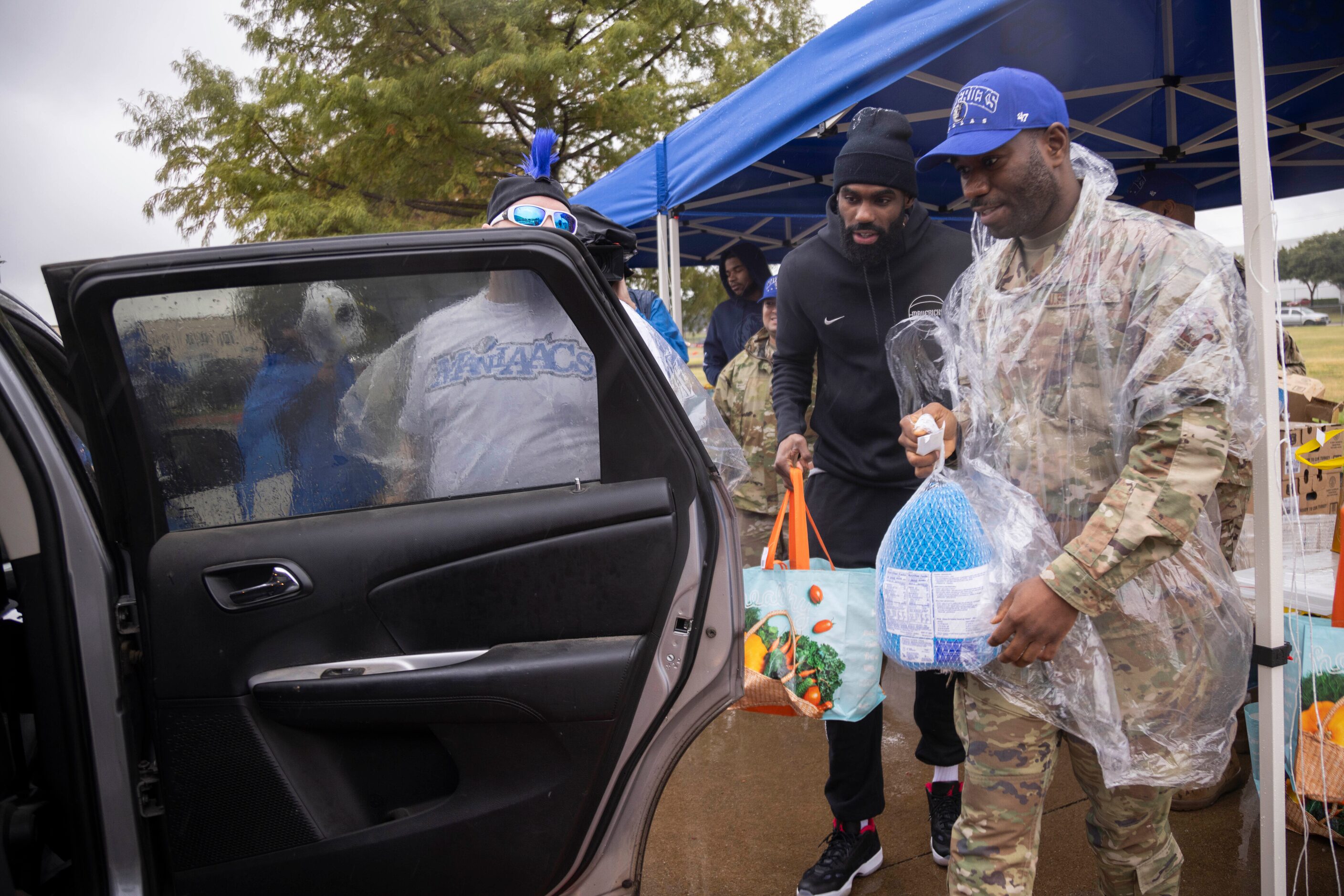 Dallas Mavericks forward Tim Hardaway Jr. (10) and Technical Sergeant (TSgt) Ibrahim Barry...