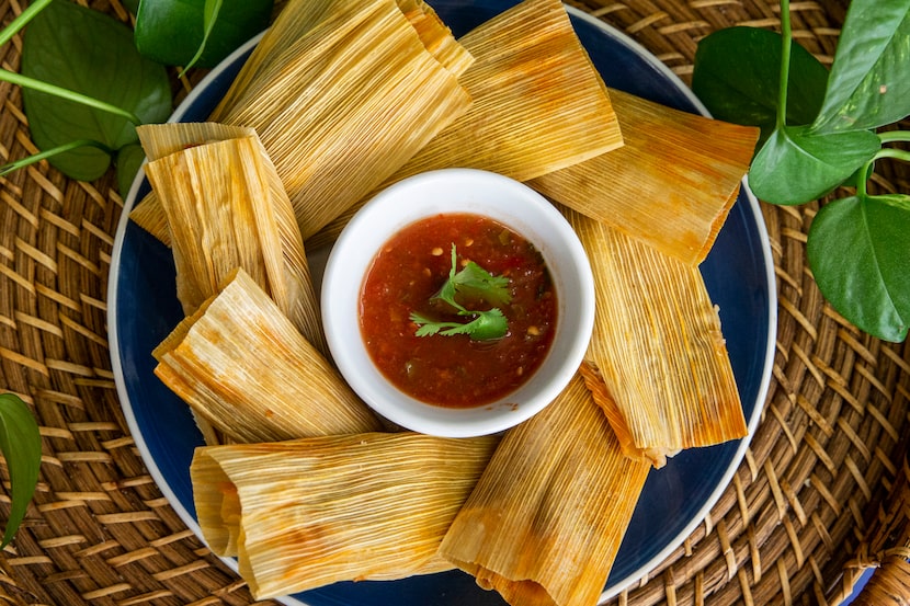 Tamales served with salsa at La Popular Tamale House on Bryan Street in Dallas