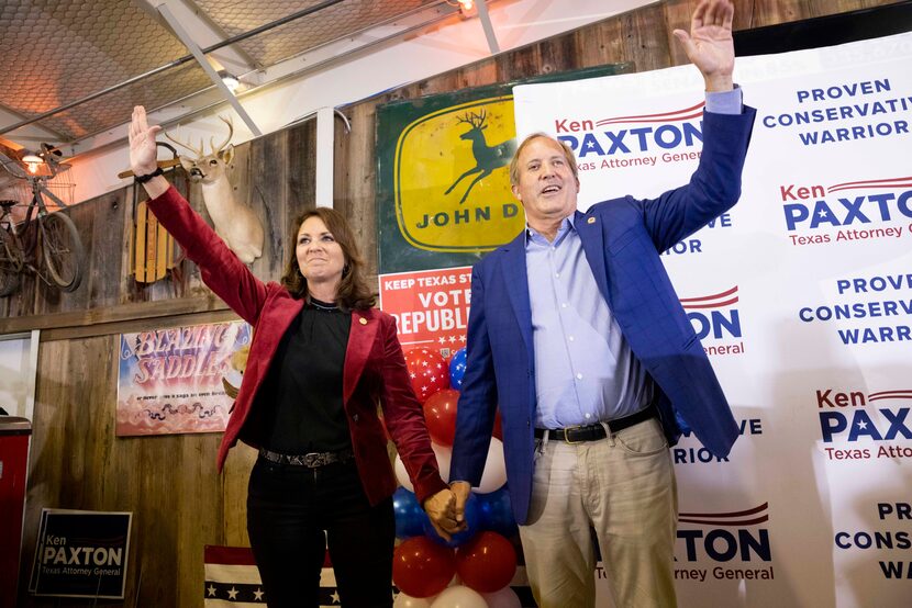 Sen. Angela Paxton and husband Attorney General Ken Paxton wave to the crowd during a Collin...