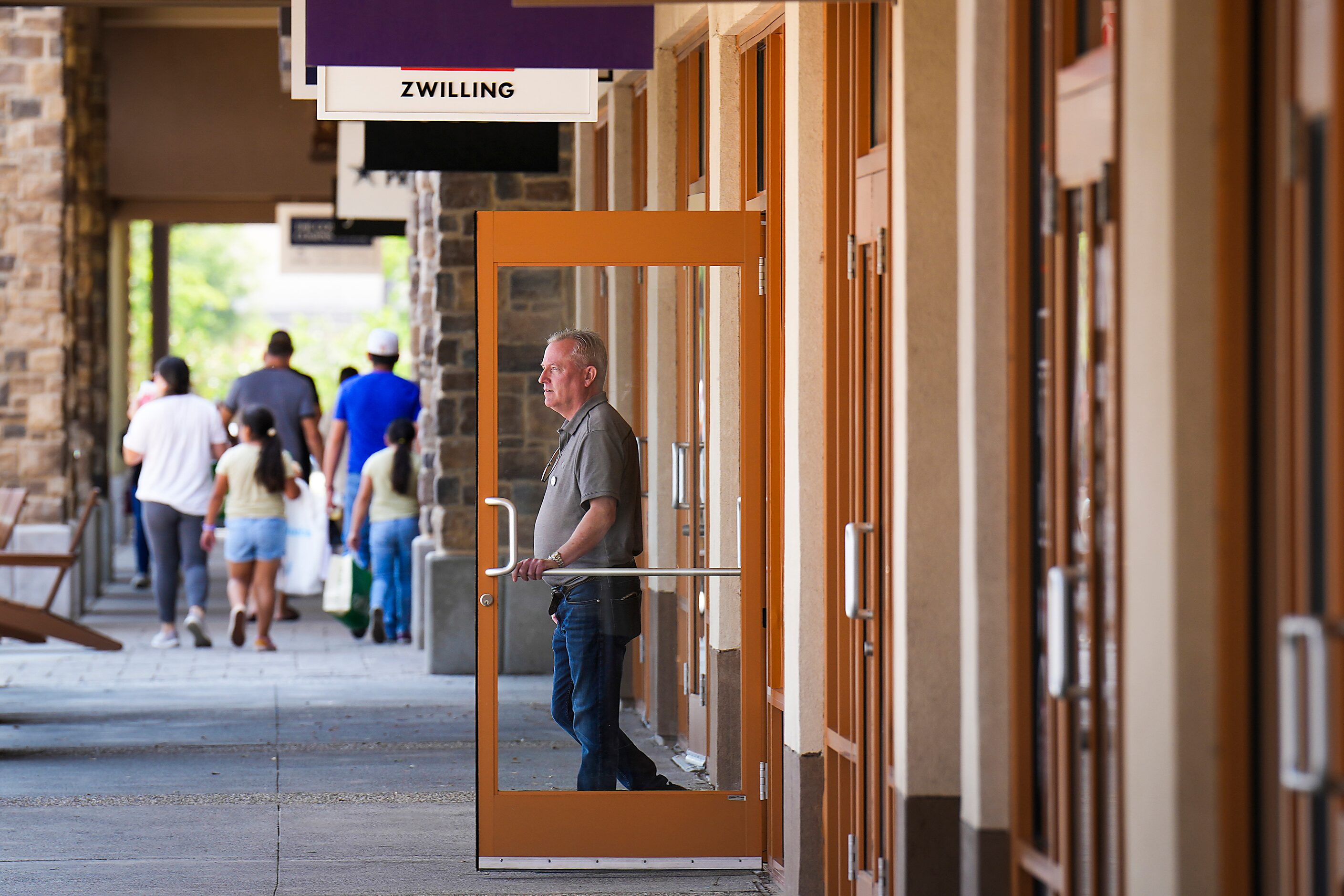 Zwilling Factory Store manager Marcus Kergosien looks out from his shop at the Allen Premium...